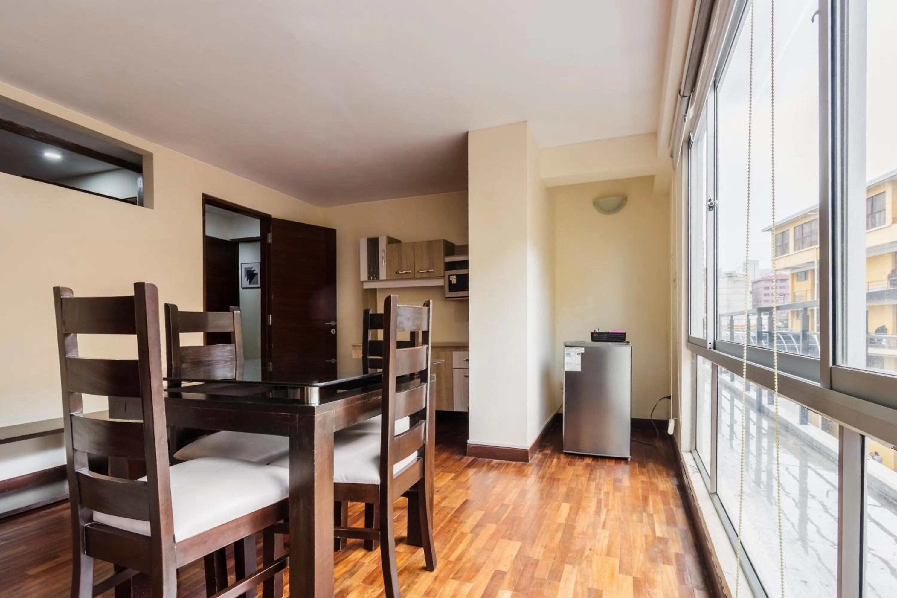 Dining area, Bed in Luxstone Executive & Suites