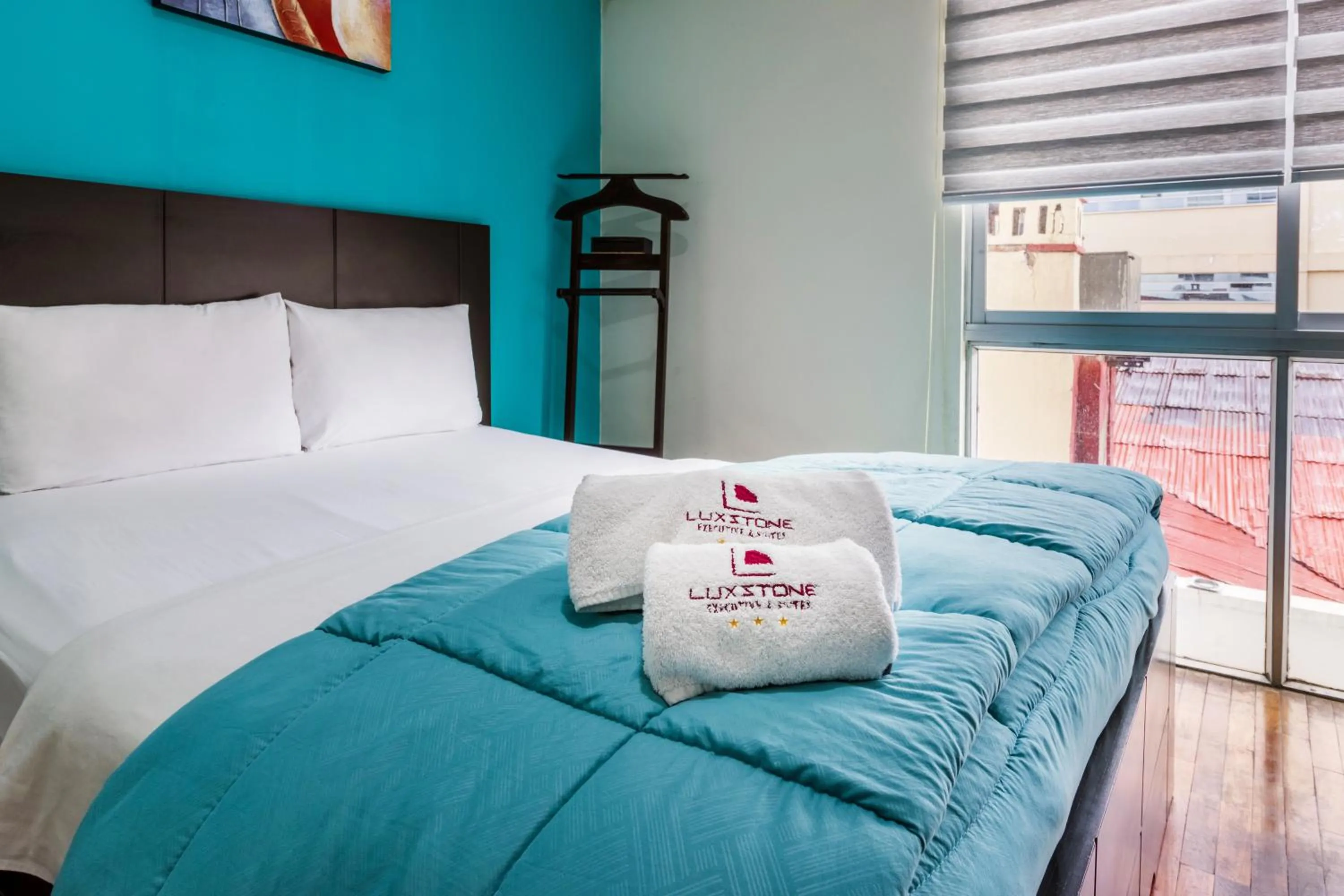 Bedroom, Bed in Luxstone Executive & Suites