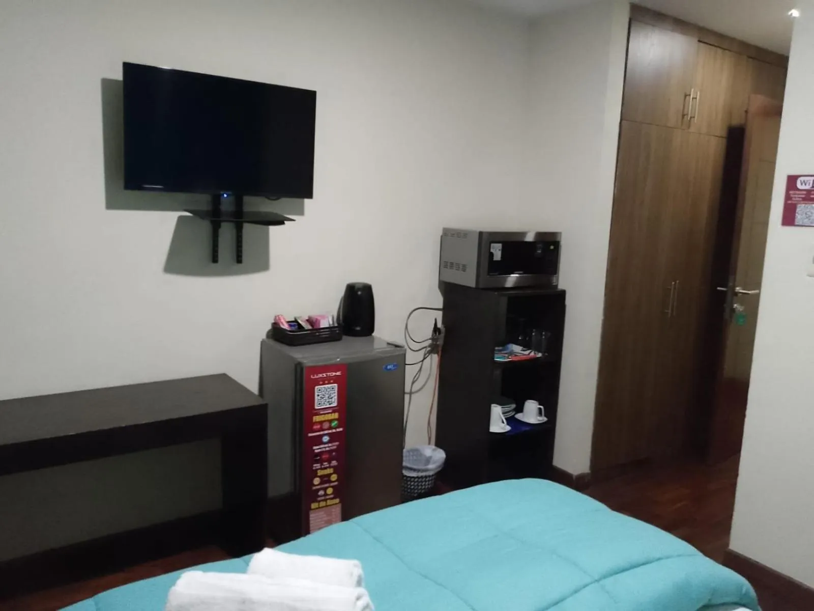 Bed in Luxstone Executive & Suites