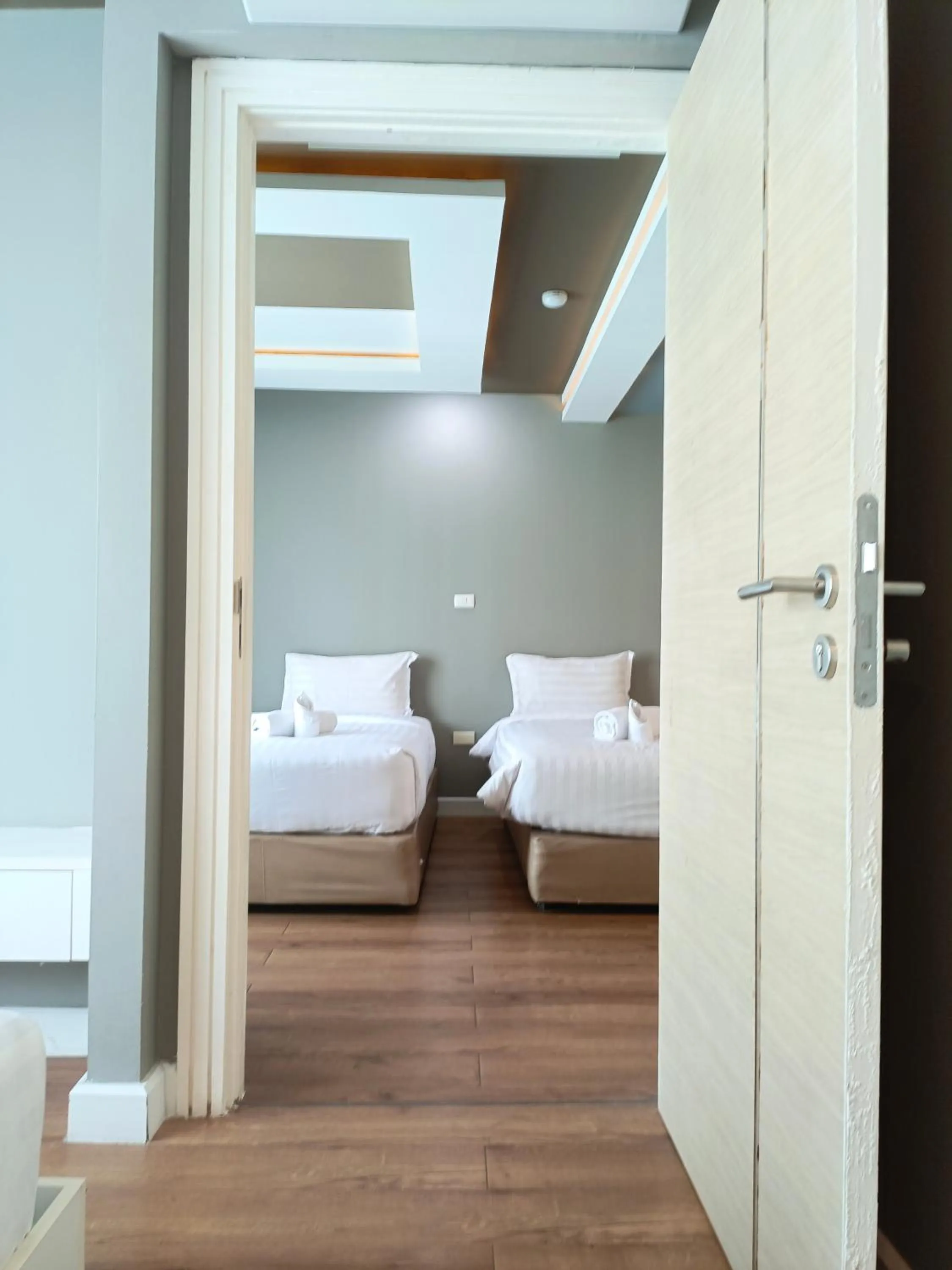 Bed in Wisdom Hotel & Residence