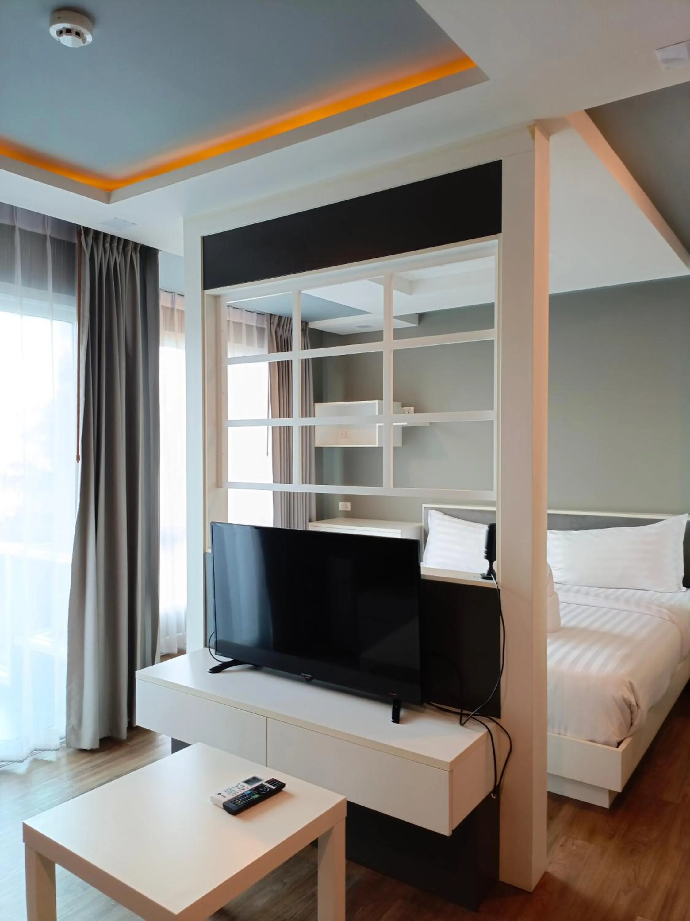 Bed in Wisdom Hotel & Residence