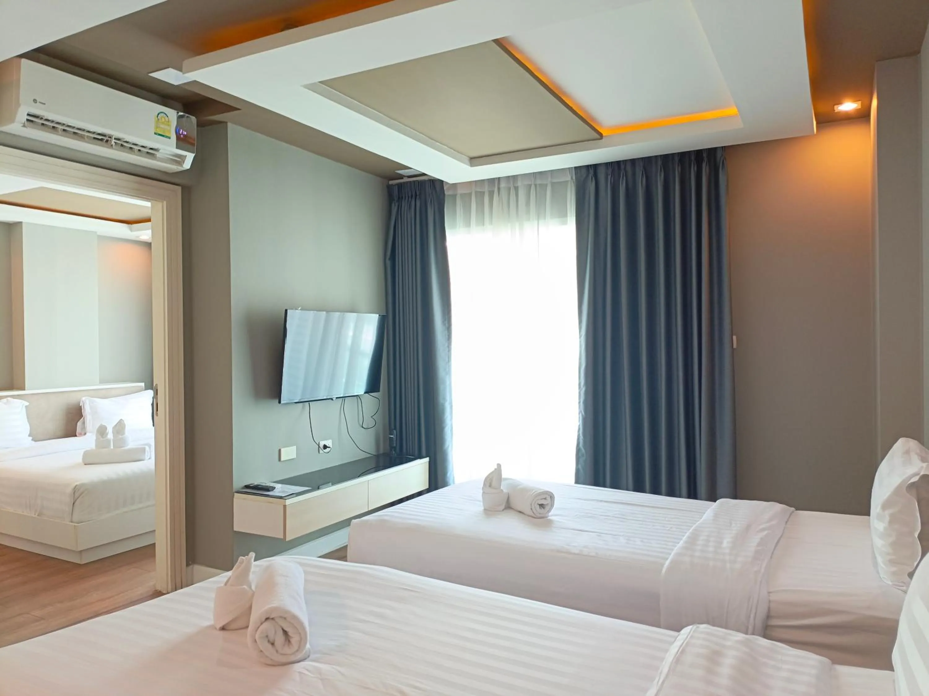 Bed in Wisdom Hotel & Residence