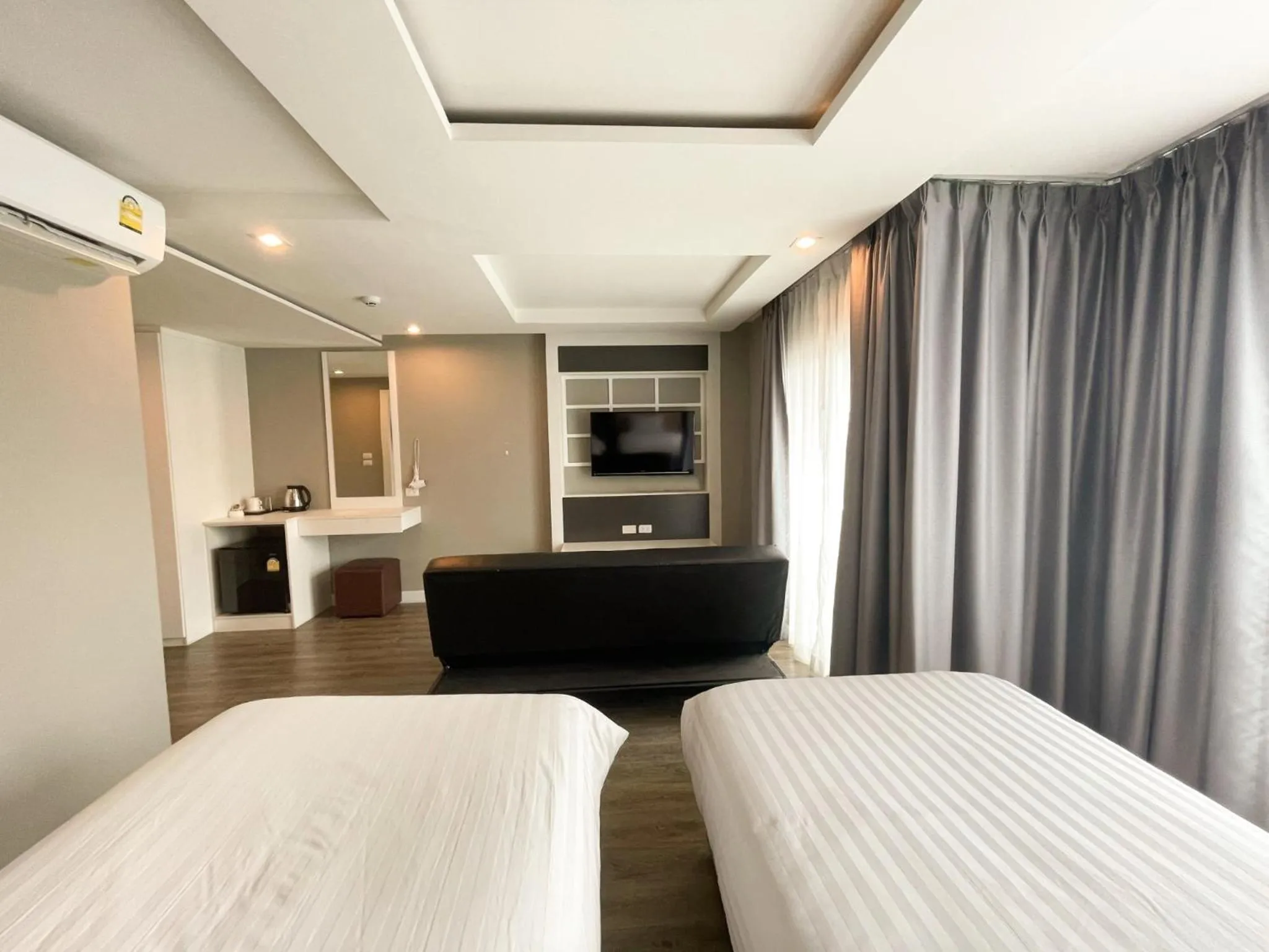 Bed in Wisdom Hotel & Residence