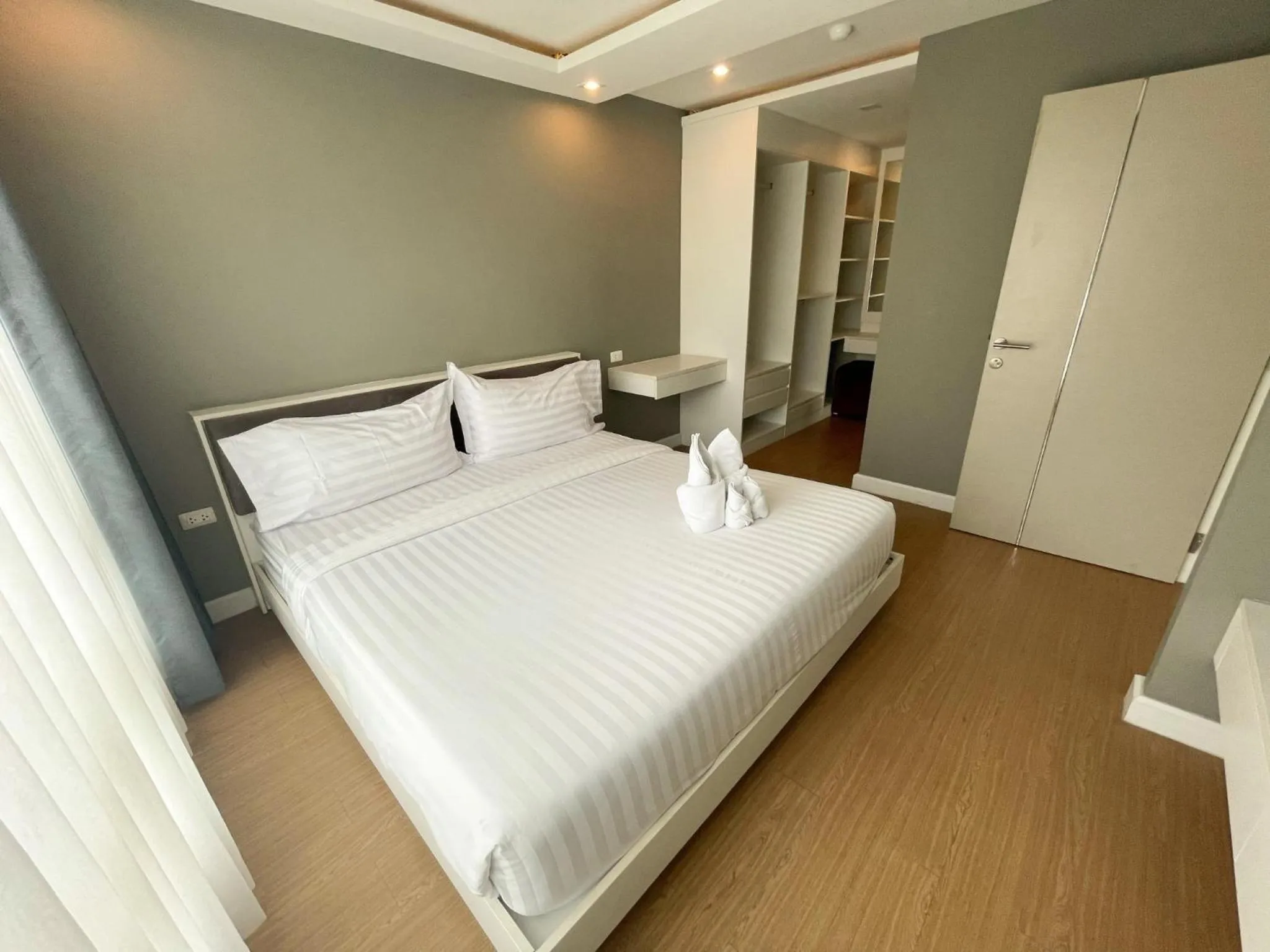 Bed in Wisdom Hotel & Residence