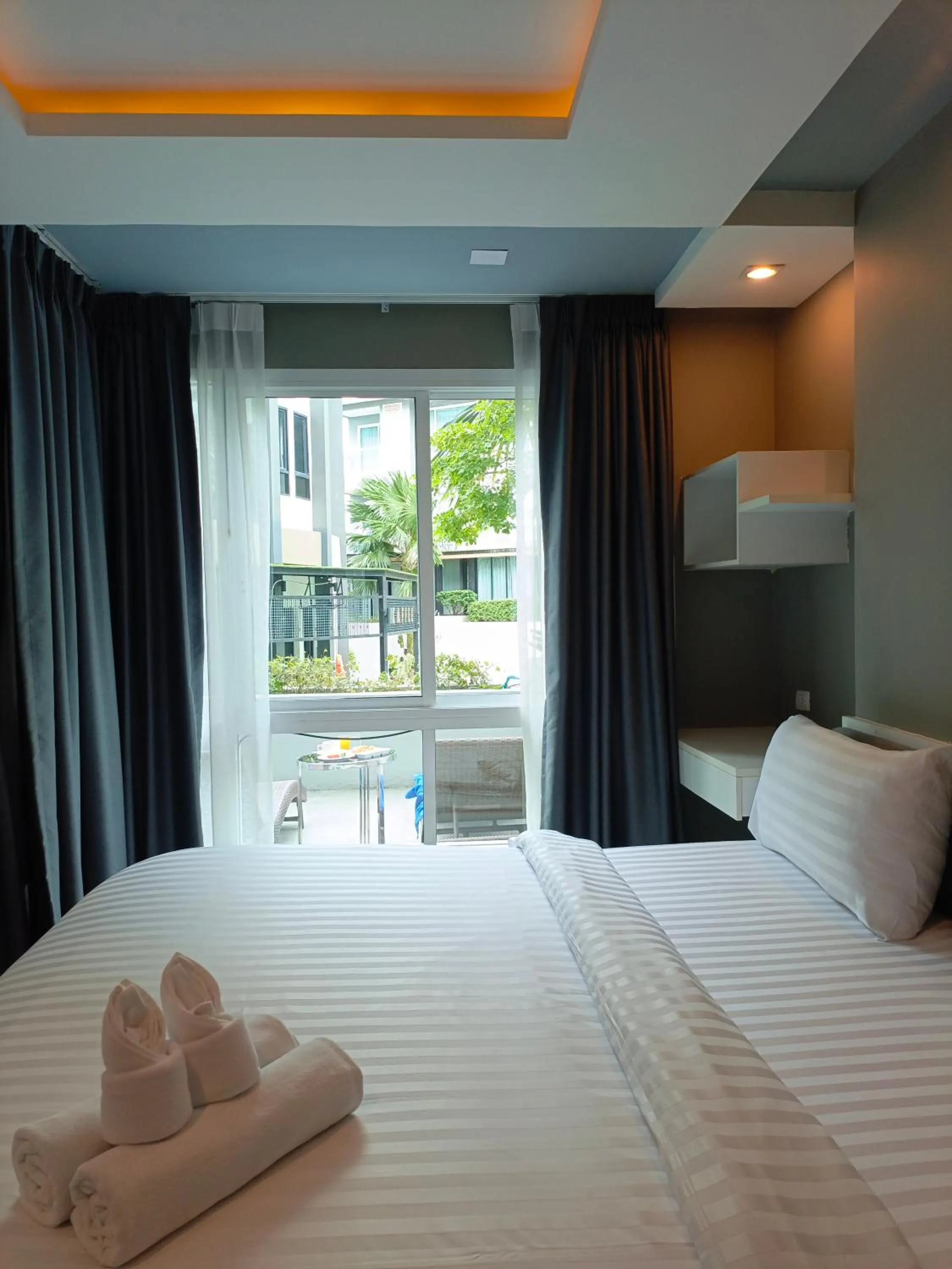 Bed in Wisdom Hotel & Residence