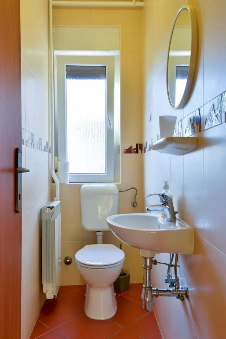 Toilet in ALEKS house with apartments