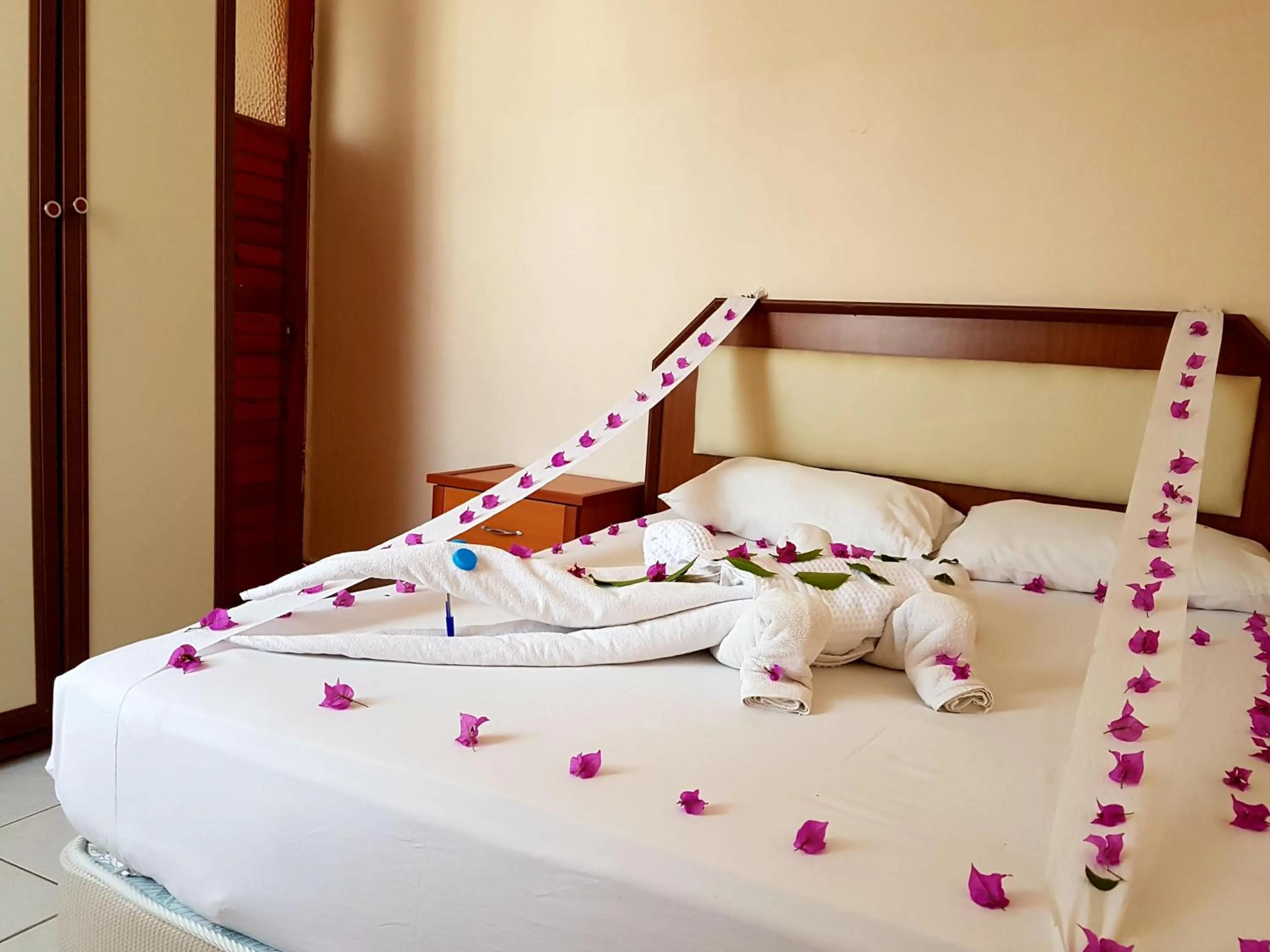 Bed in Palmen Apart Hotel