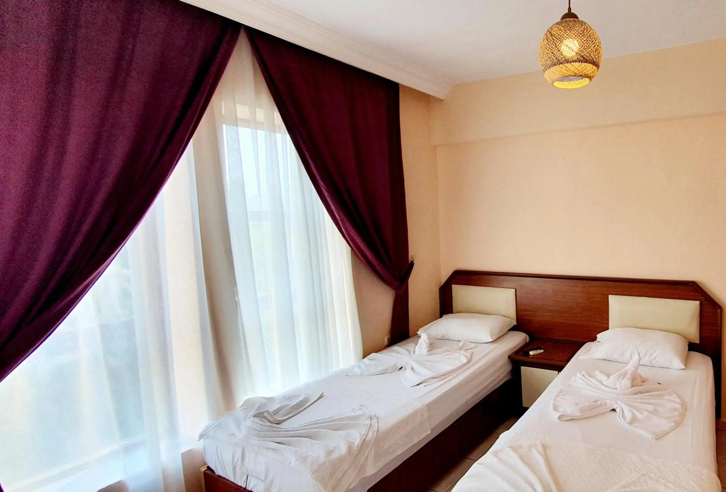 Bed in Palmen Apart Hotel