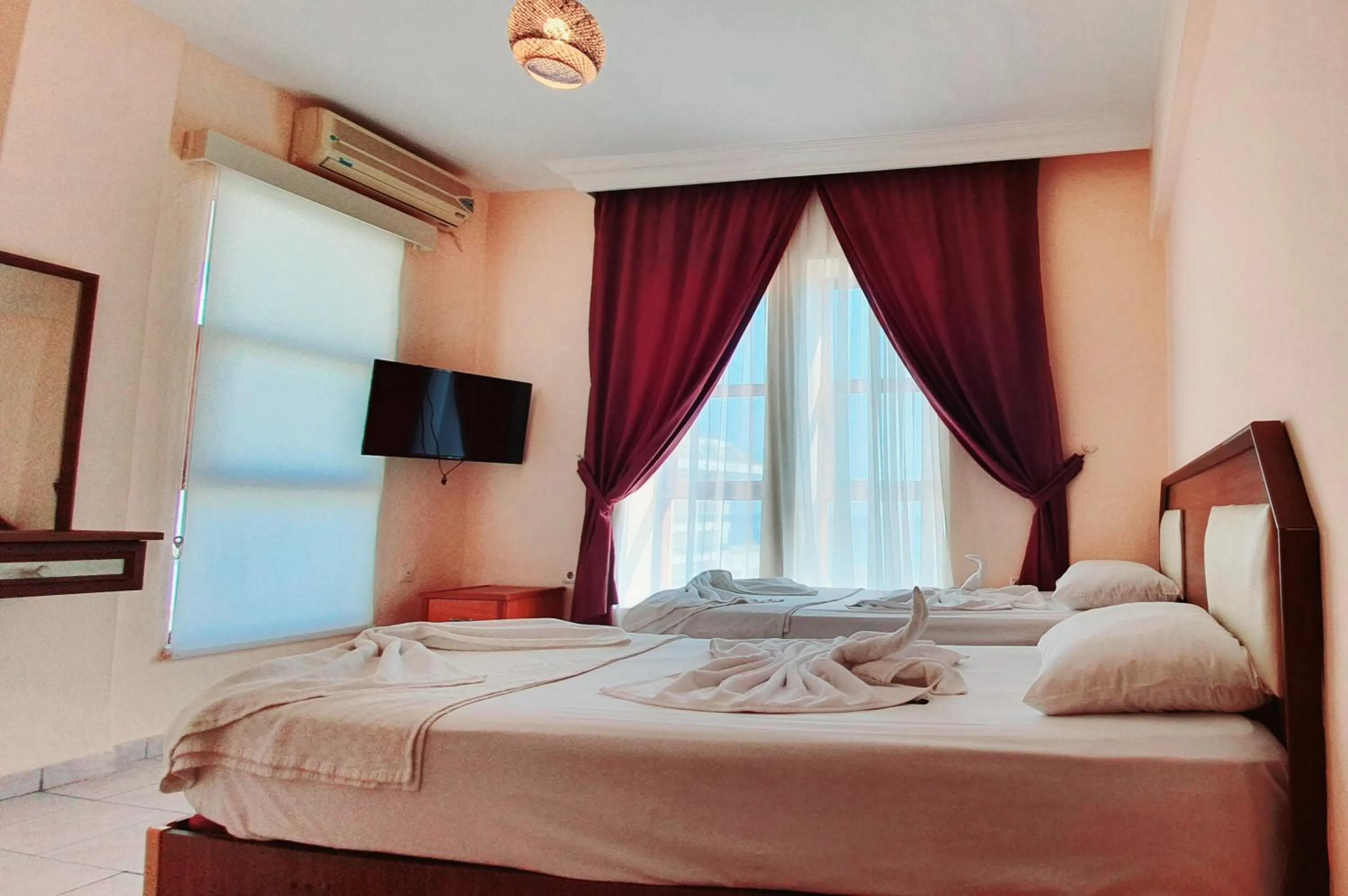 Bed in Palmen Apart Hotel