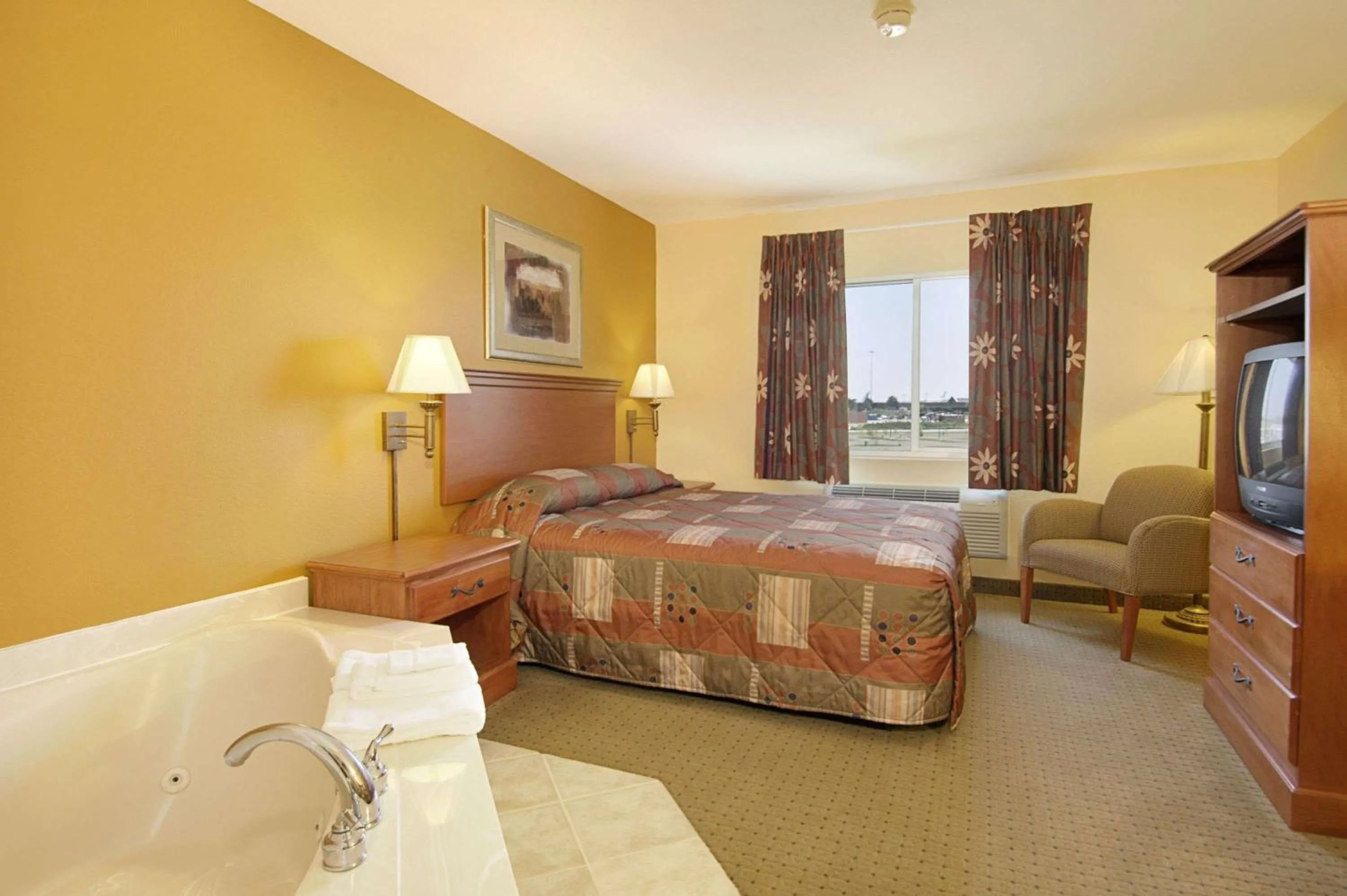 Photo of the whole room, Bed in Super 8 by Wyndham Topeka at Forbes Landing