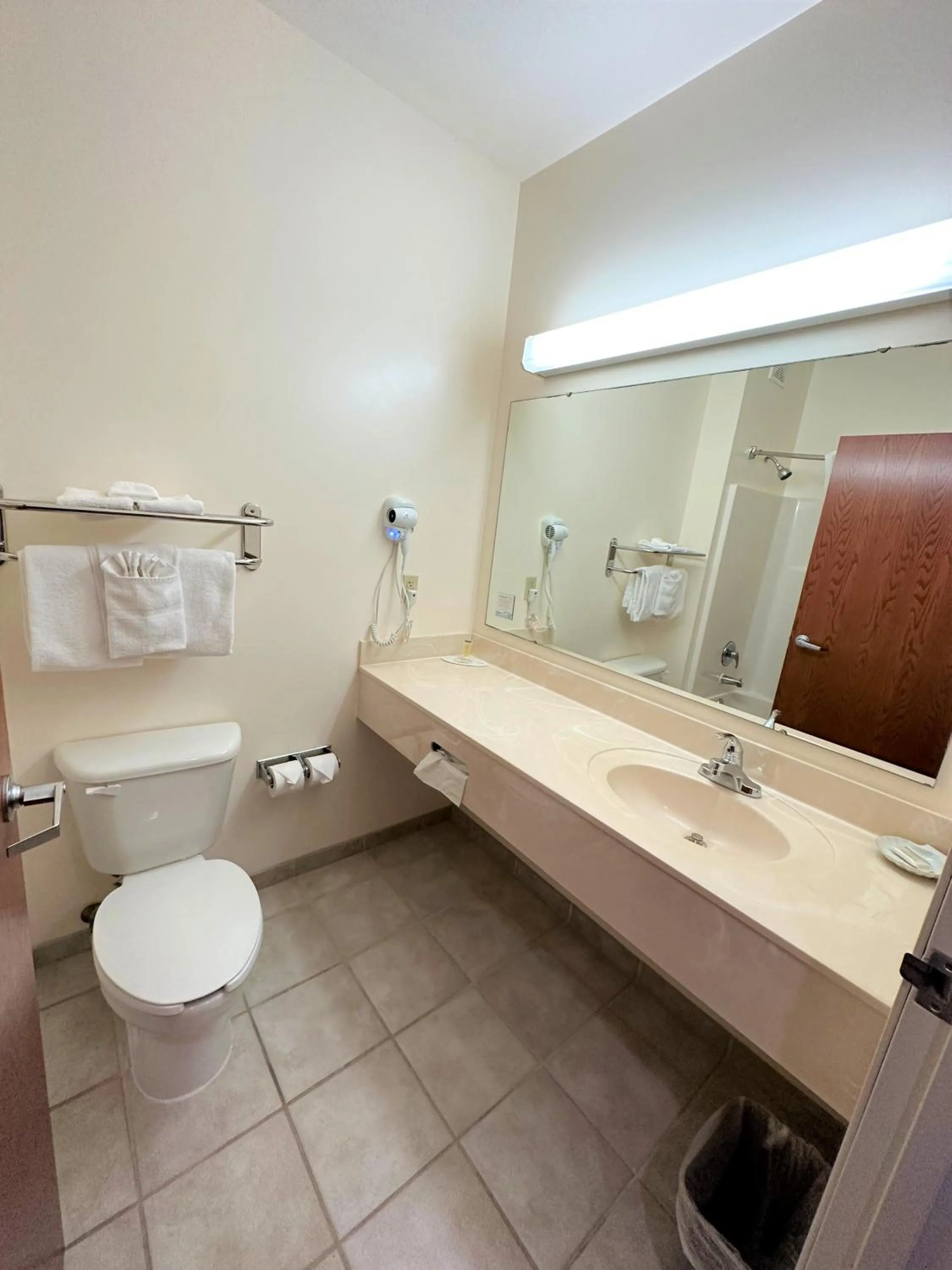 Toilet in Super 8 by Wyndham Topeka at Forbes Landing