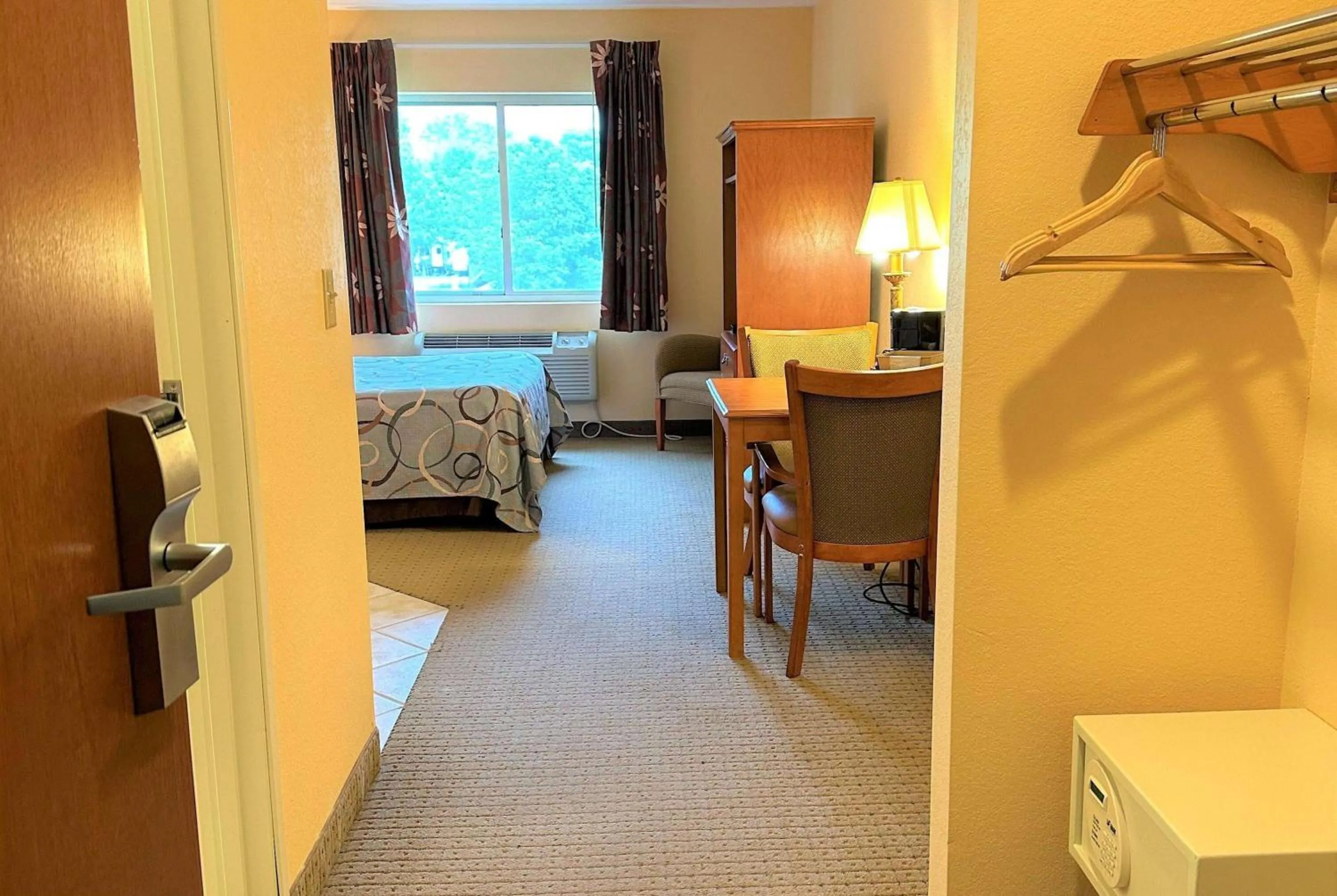 Photo of the whole room, Bed in Super 8 by Wyndham Topeka at Forbes Landing