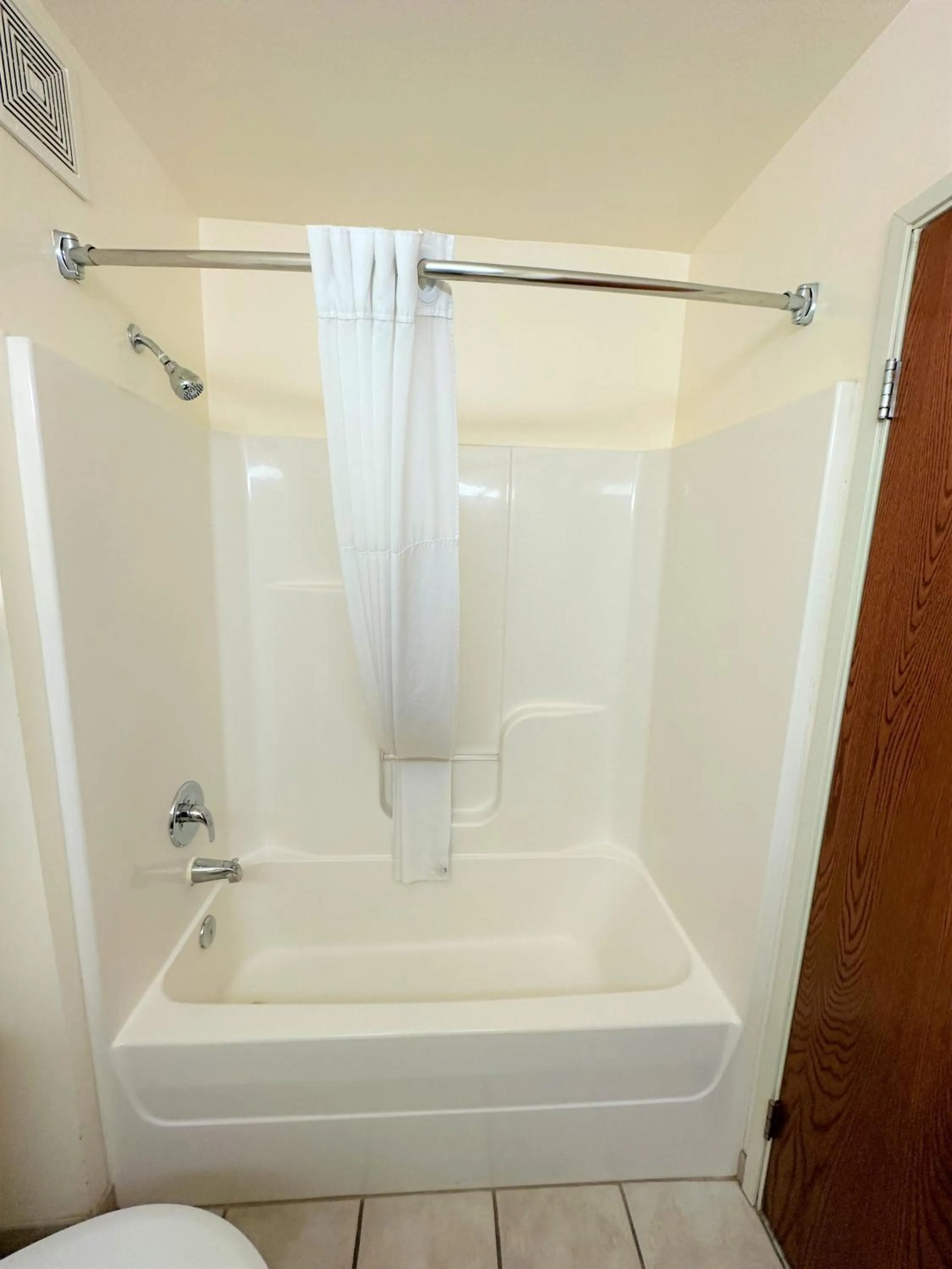 Bathroom in Super 8 by Wyndham Topeka at Forbes Landing