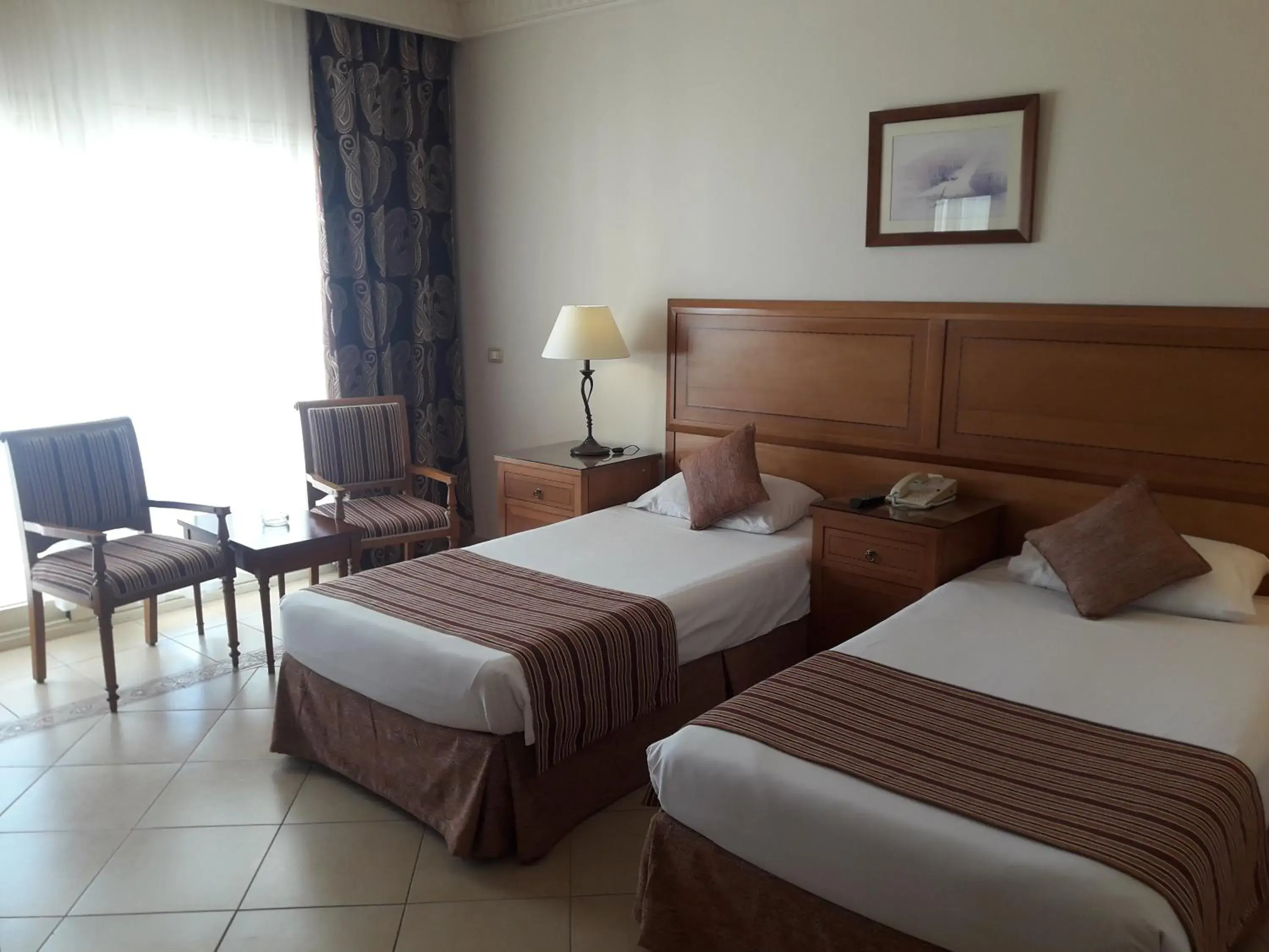 Bed in Continental Plaza Beach Resort Bed in Continental Plaza Beach Resort