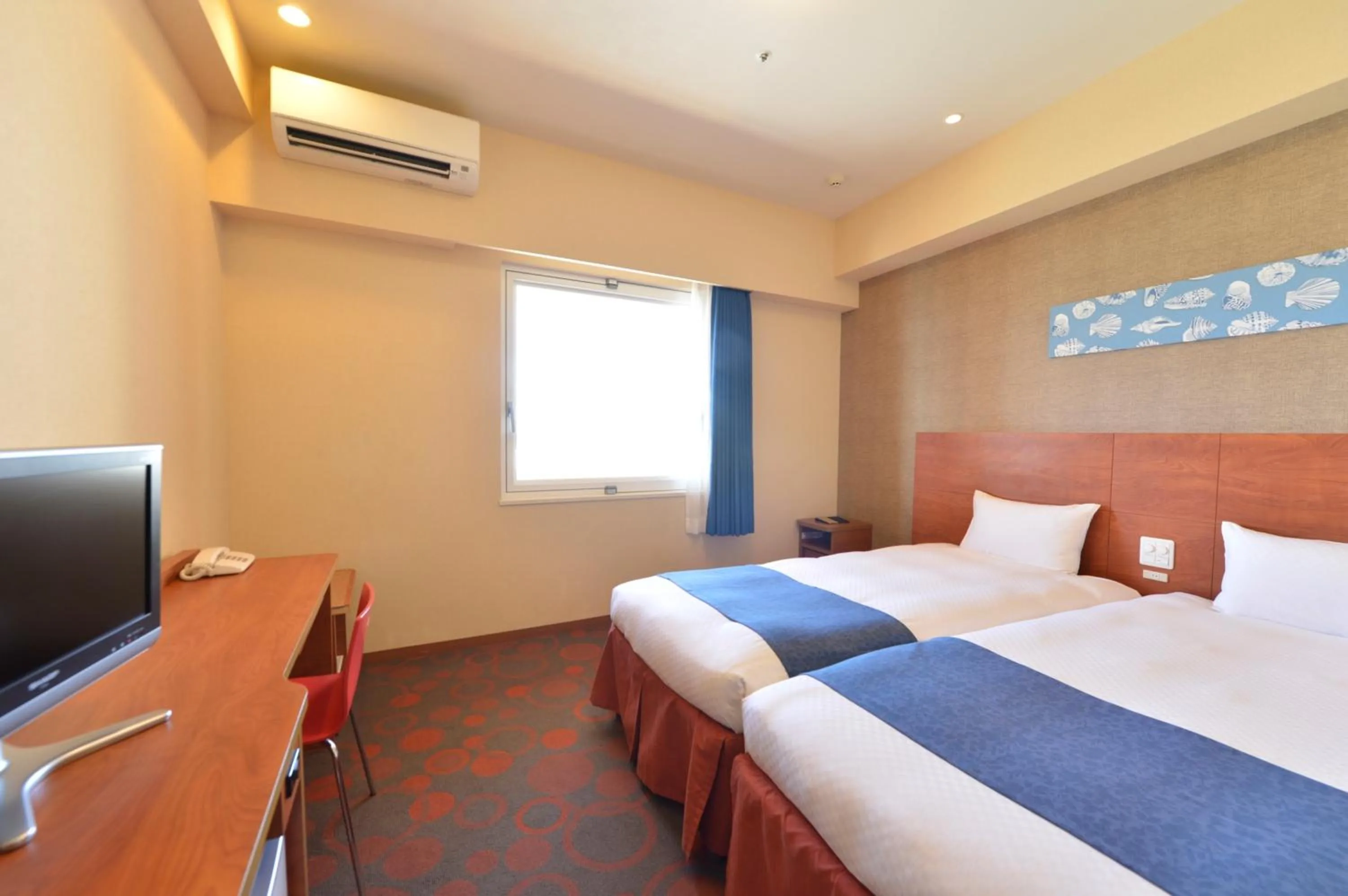 Bed in Loisir Hotel Naha