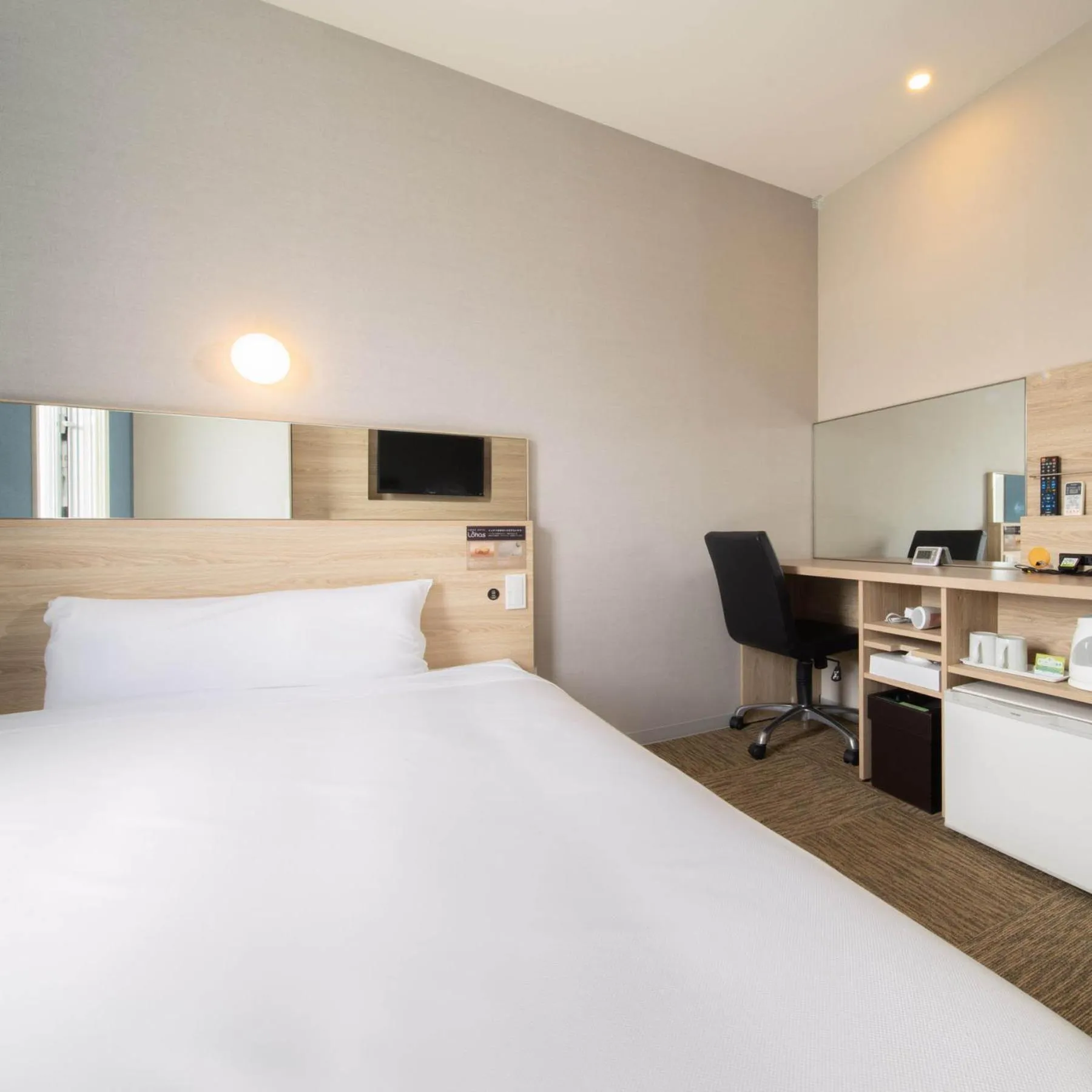 Bed in Super Hotel Okinawa Nago