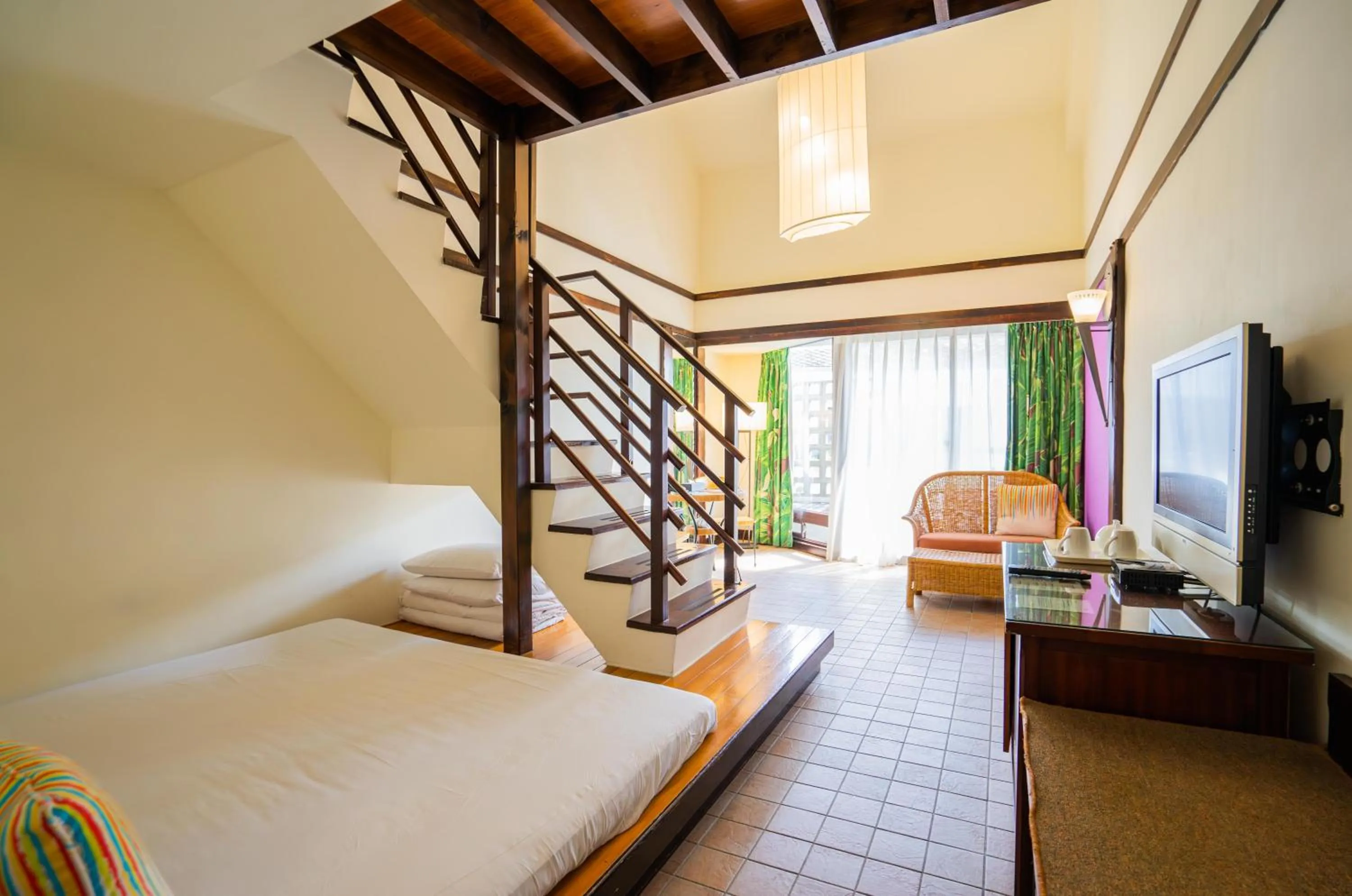 Seating area, Bed in Yoho Beach Resort Kenting