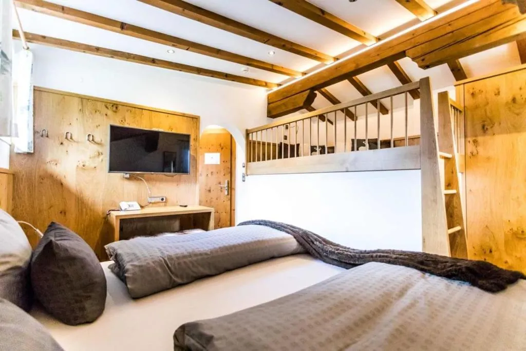 Bed in ALPENHOTEL TYROL - B&B - ADULTS ONLY - Alpines Lifestylehotel