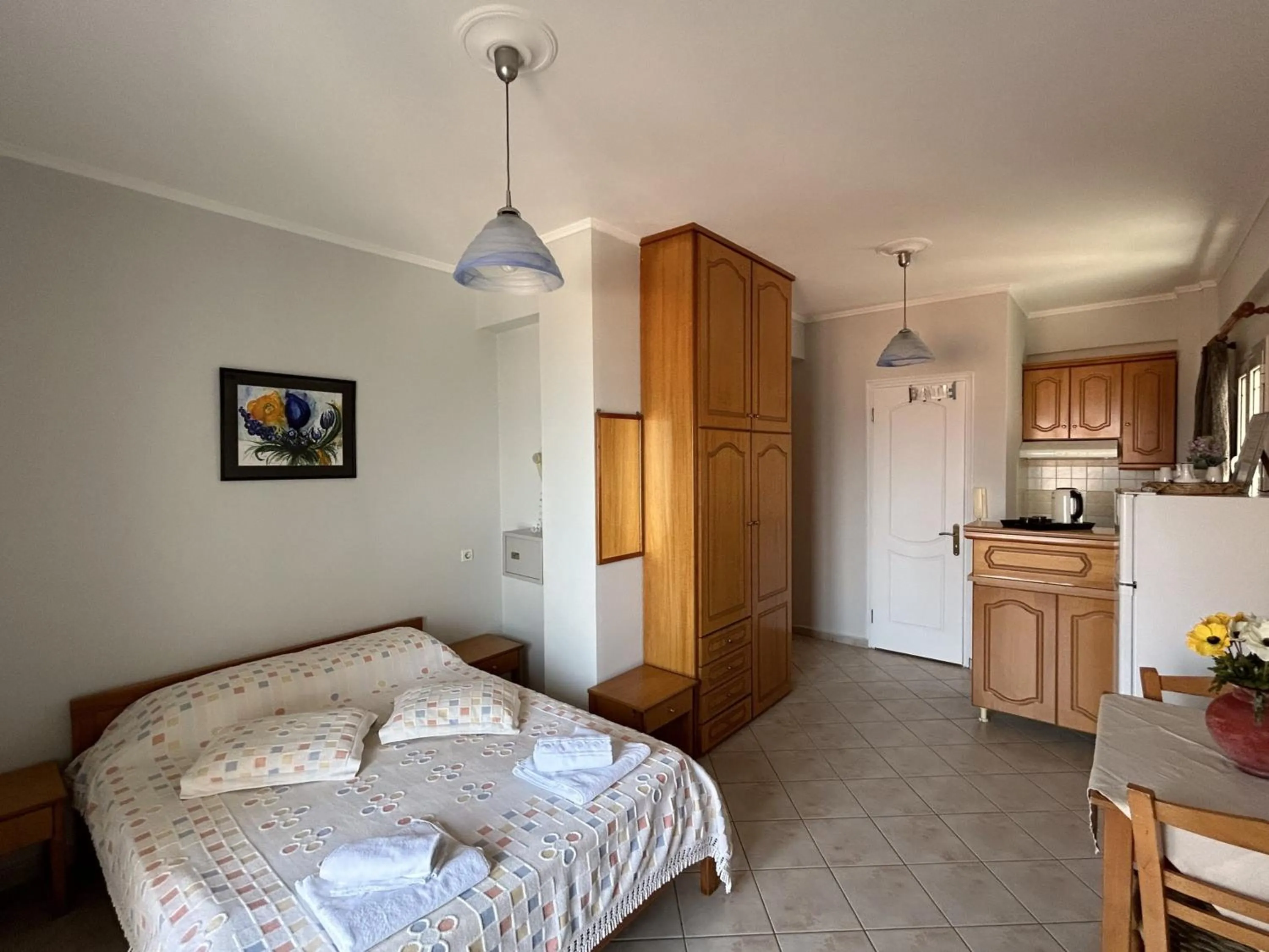 Bed in Brati II Beach Hotel