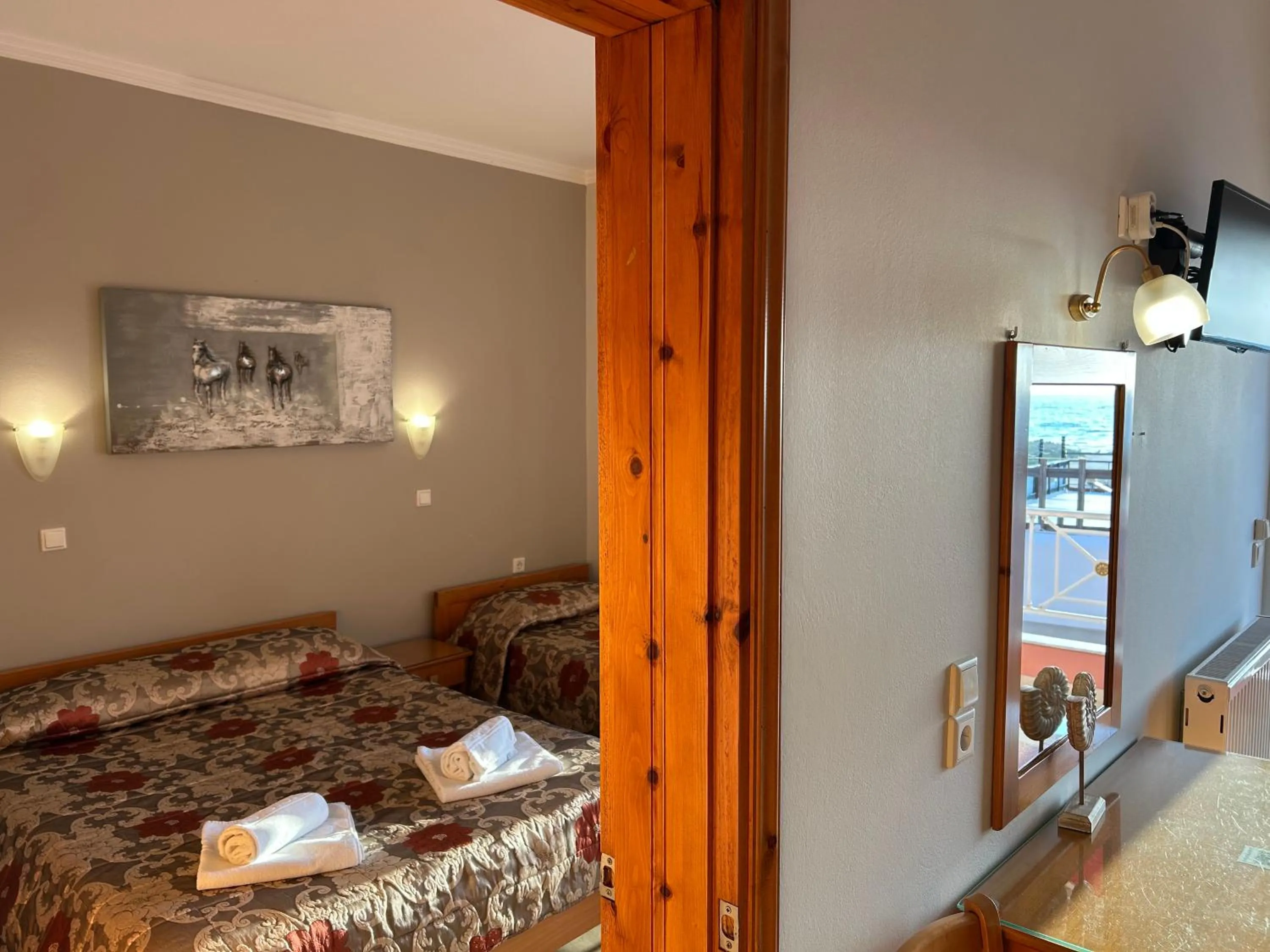 Communal lounge/ TV room, Bed in Brati II Beach Hotel
