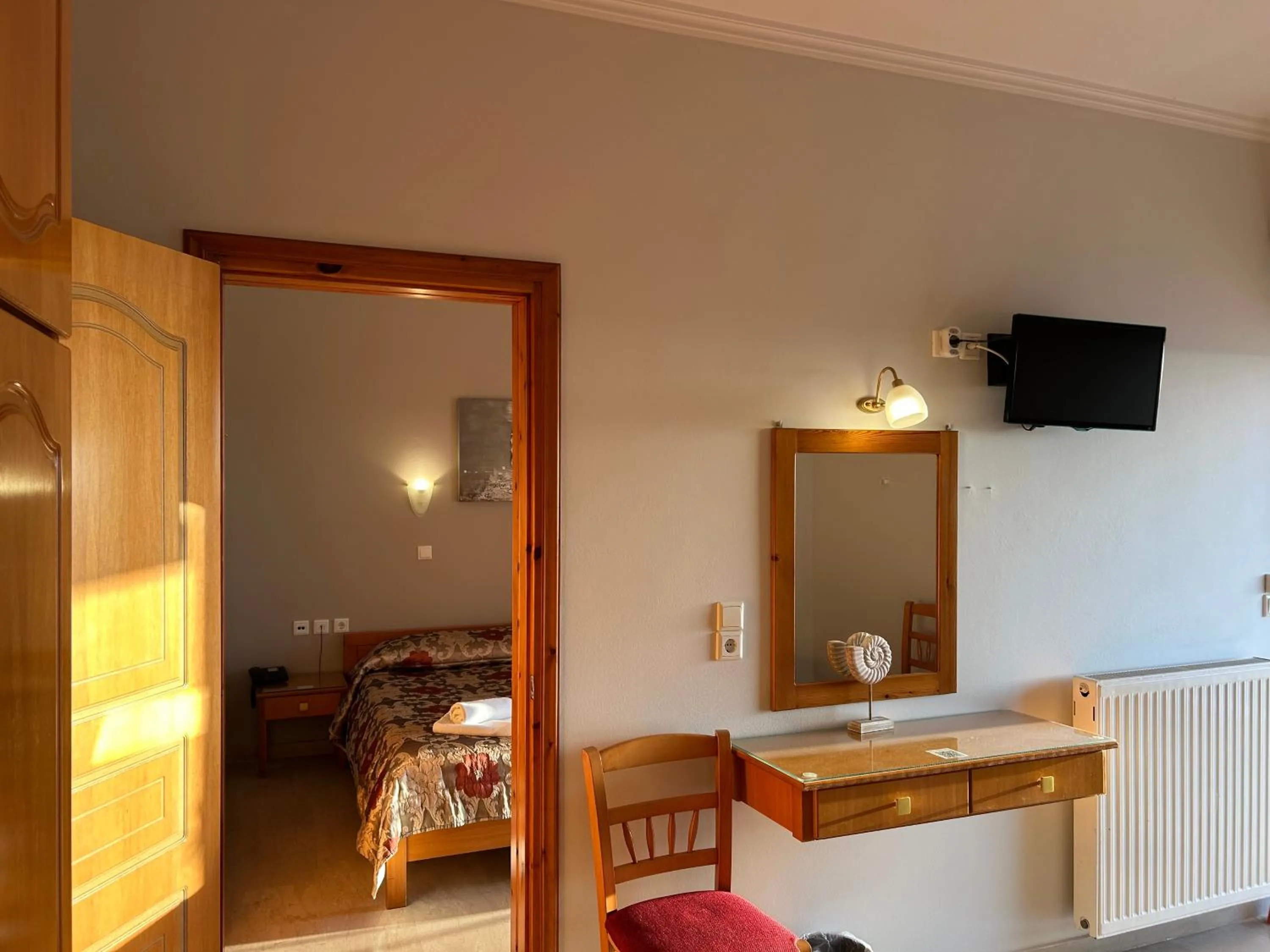 Bed in Brati II Beach Hotel