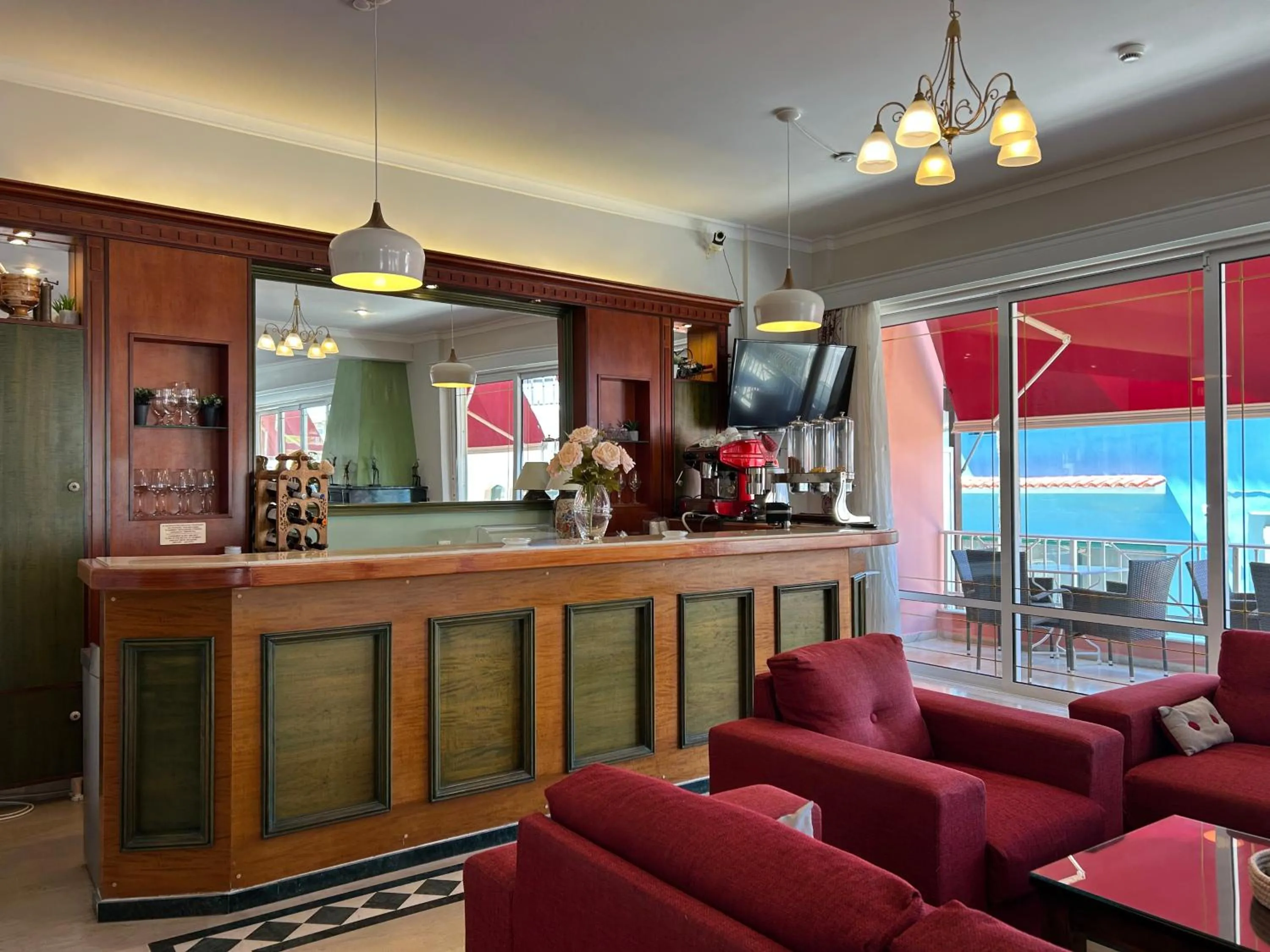 Communal lounge/ TV room in Brati II Beach Hotel