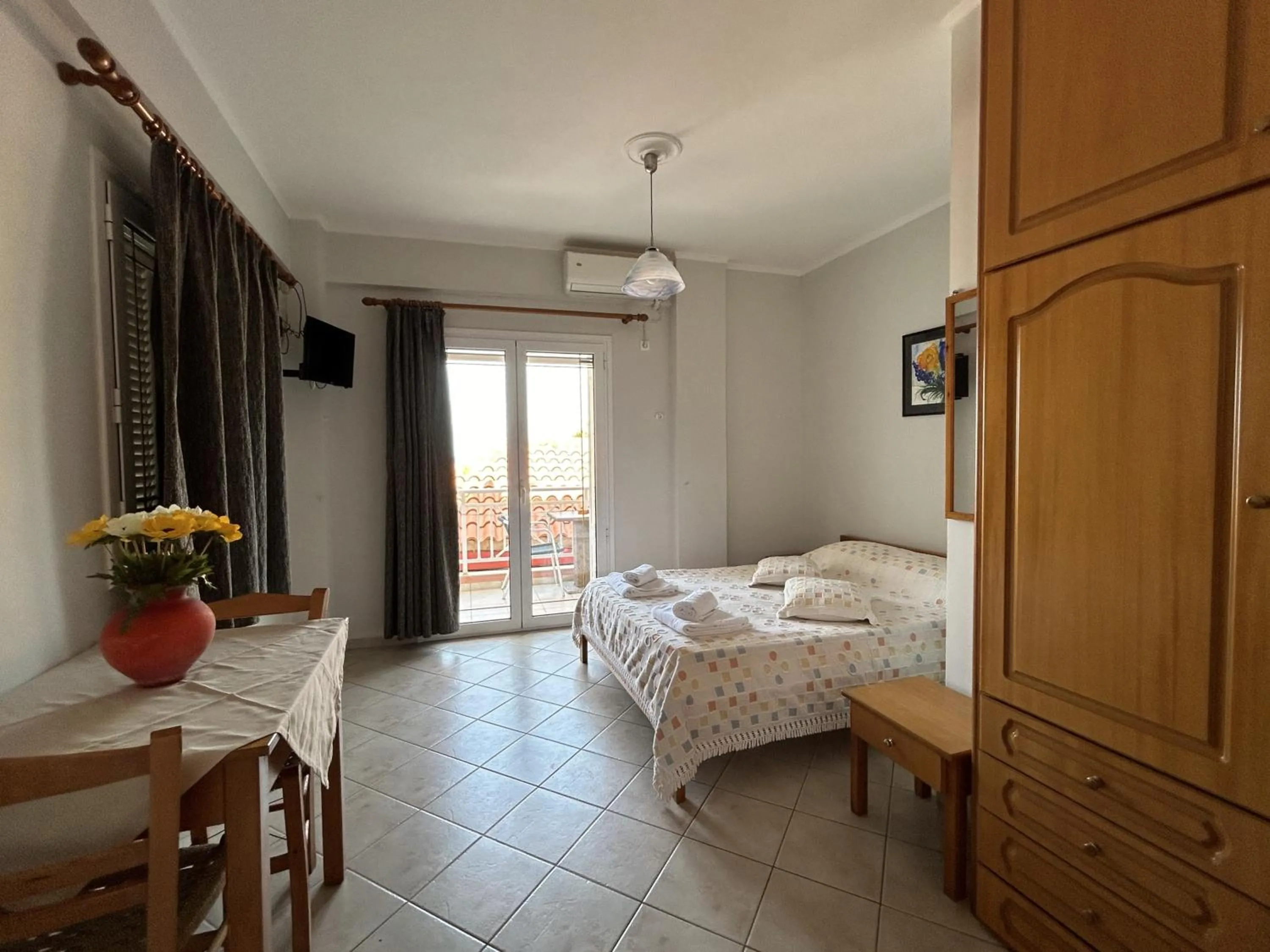 Bed in Brati II Beach Hotel