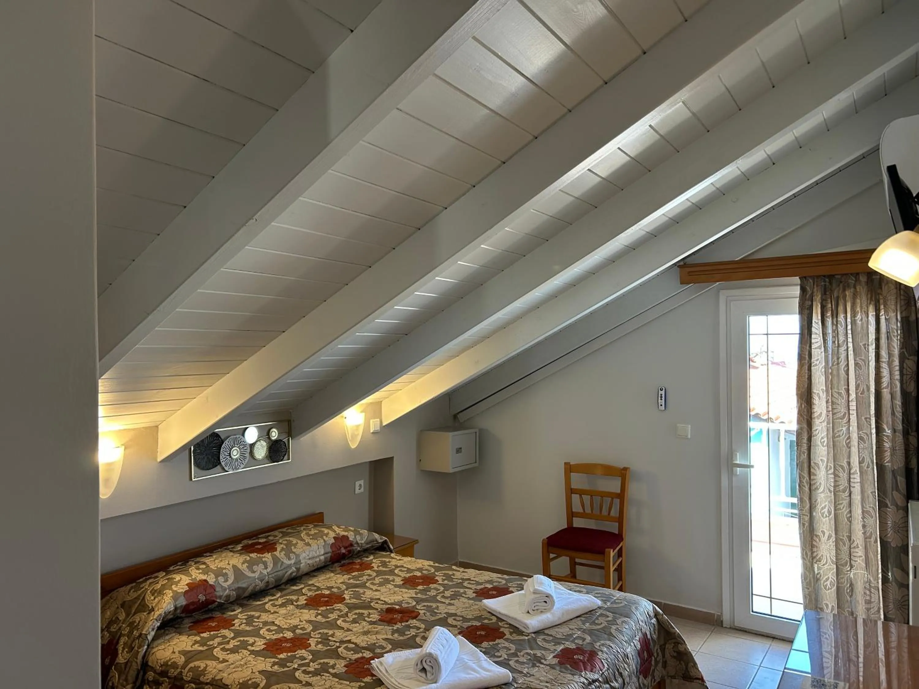 Bed in Brati II Beach Hotel