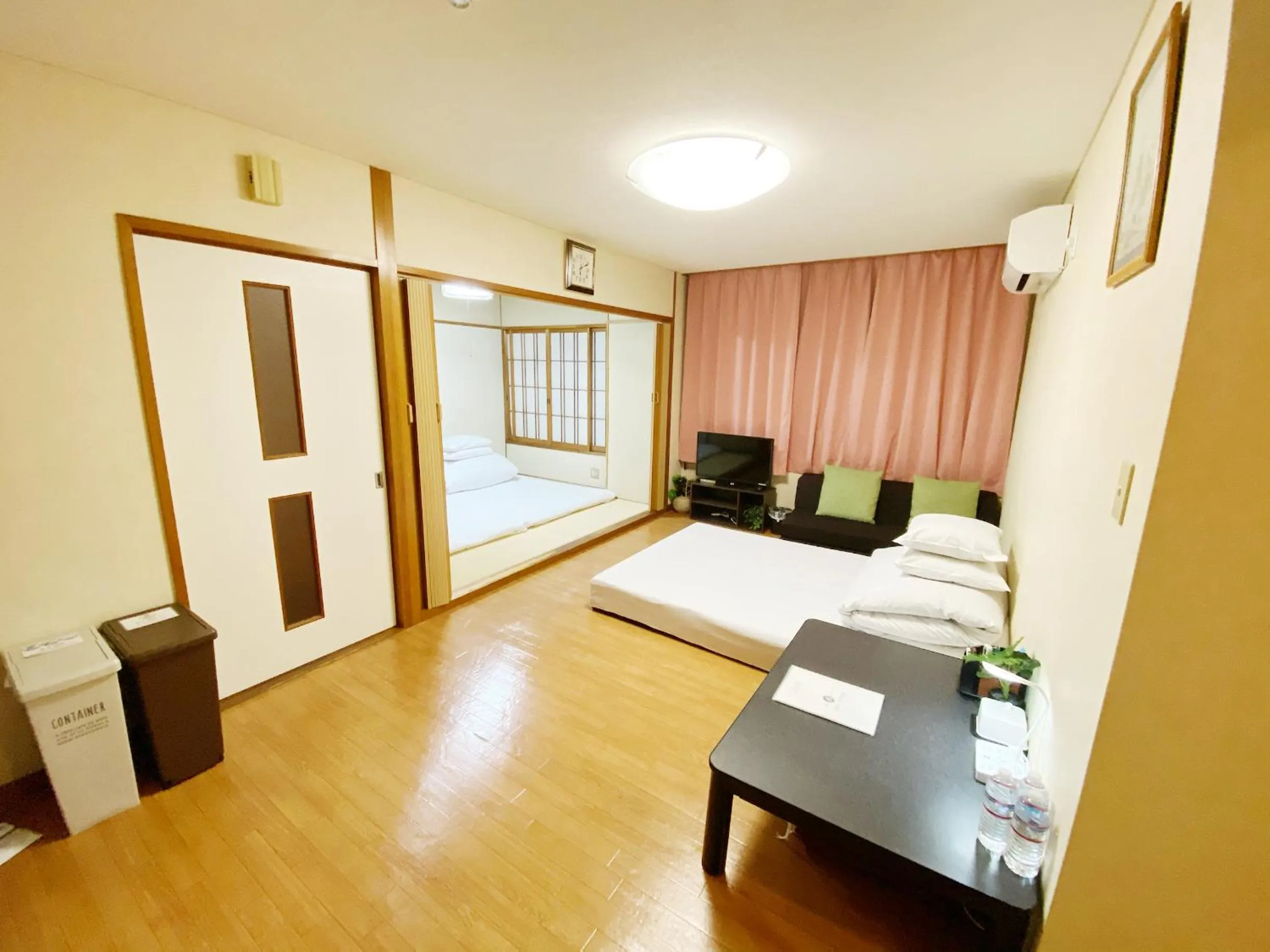 Living room, Bed in GuestHouse017徳島個室 飲食街中心 阿波踊り会館7分 文理&徳島大学 アスティとくしま車8分