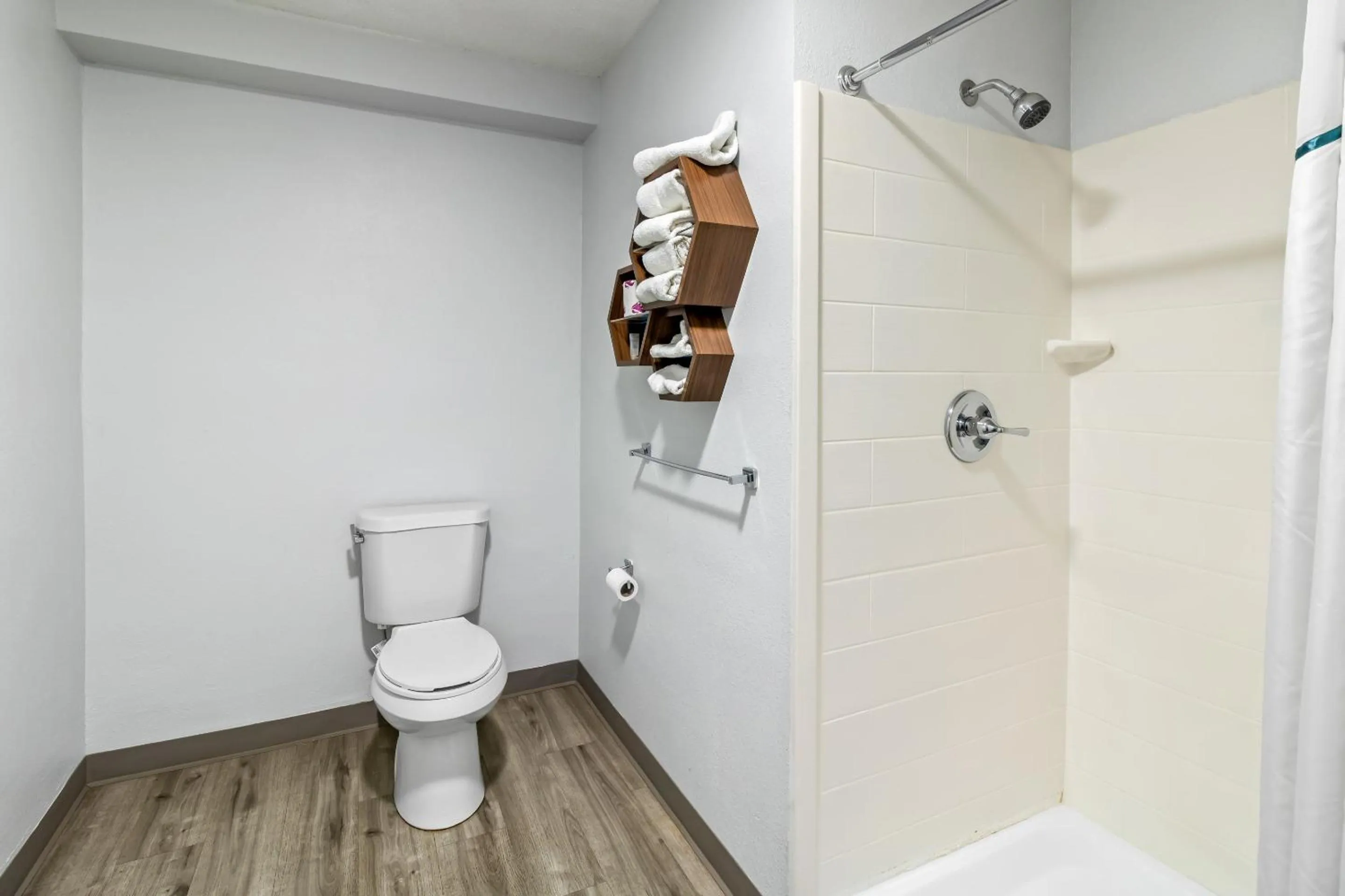 Shower in HomeTowne Studios by Red Roof Florence, KY-Cincinnati Airport