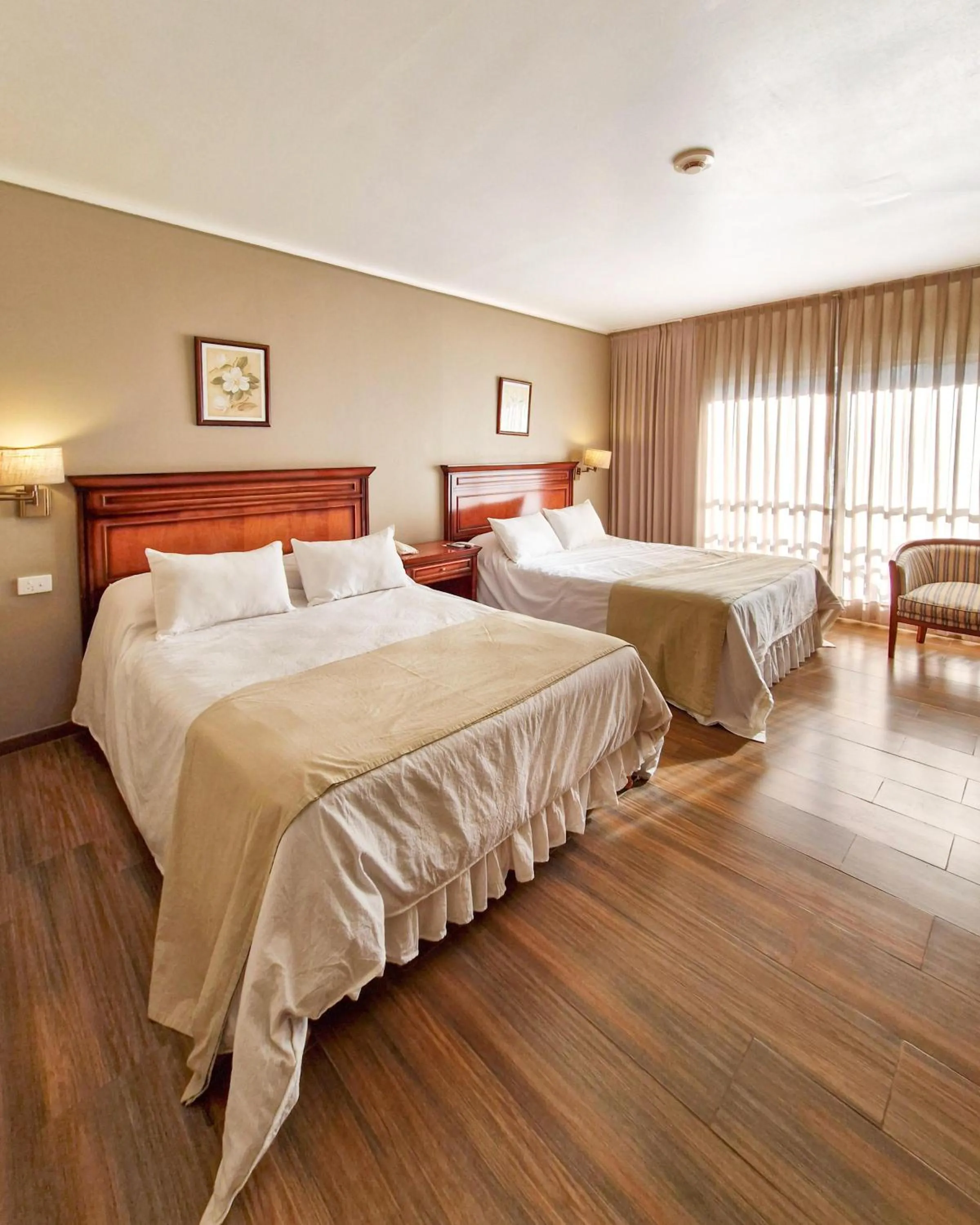 Bed in Howard Johnson Hotel & Spa Villa General Belgrano