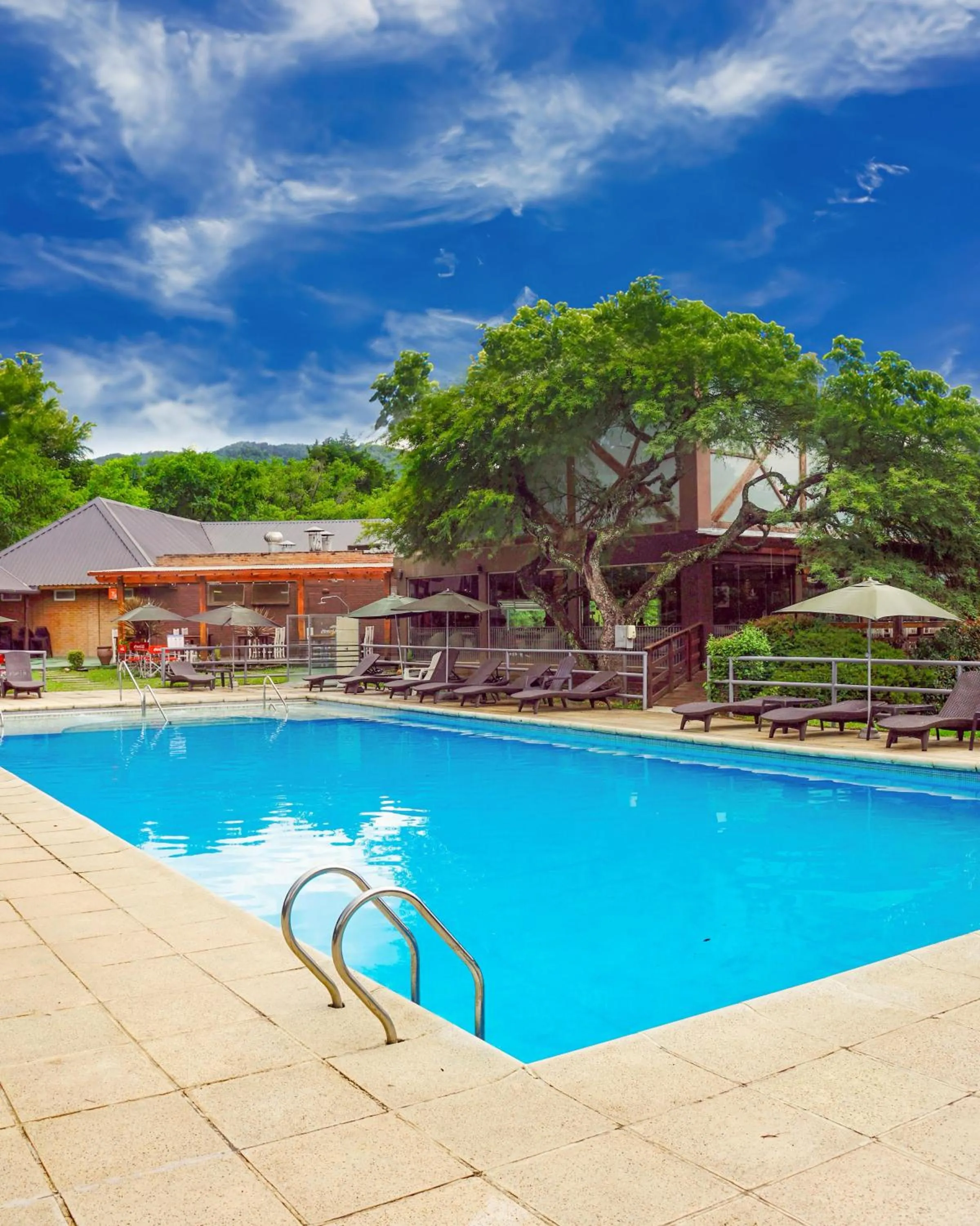 Swimming pool in Howard Johnson Hotel & Spa Villa General Belgrano