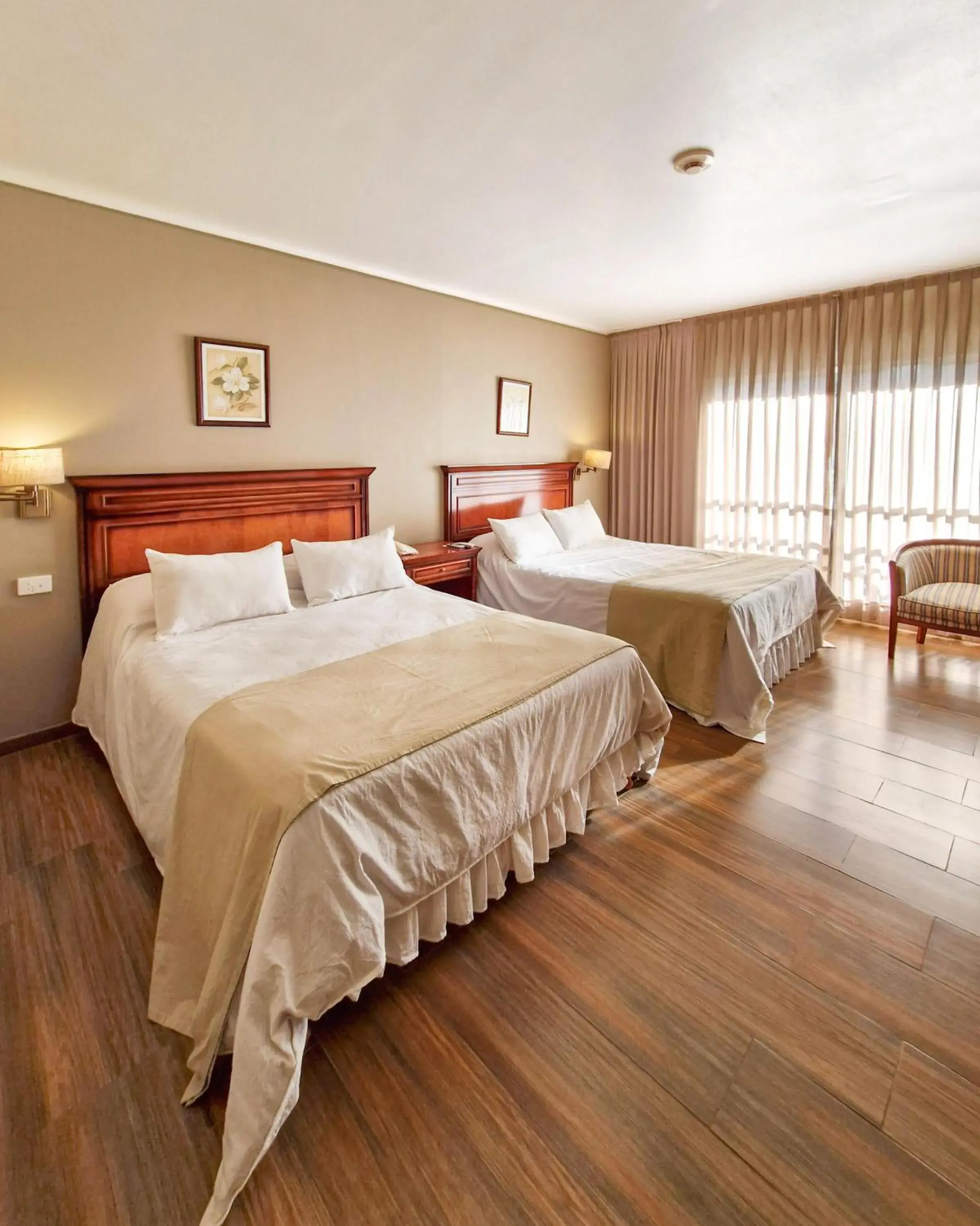 Bed in Howard Johnson Hotel & Spa Villa General Belgrano Bed in Howard Johnson Hotel & Spa Villa General Belgrano