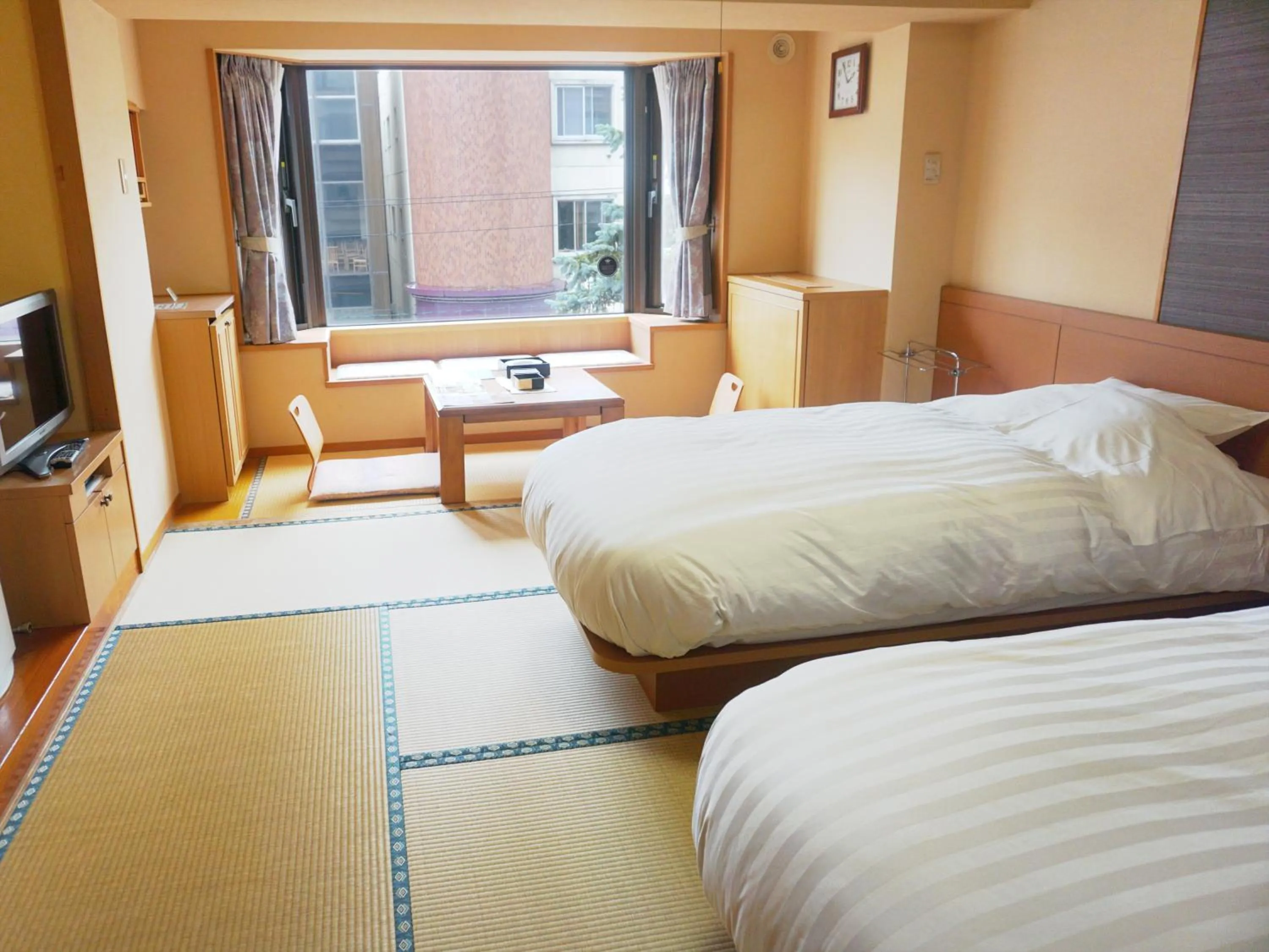 View (from property/room), Bed in THE FOREST AKAN Tsuruga Resort
