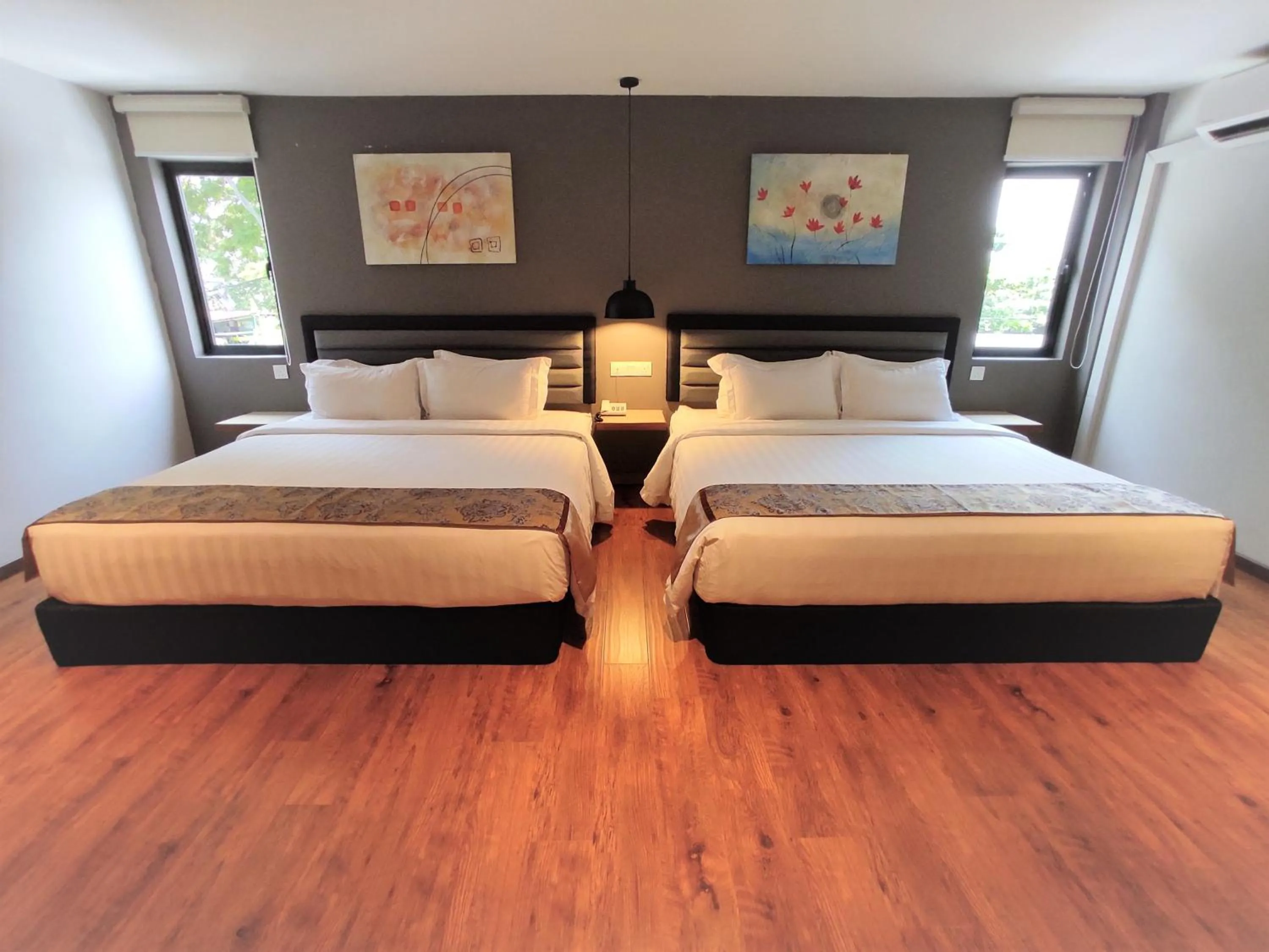 Bed in Apple Suites Hotel