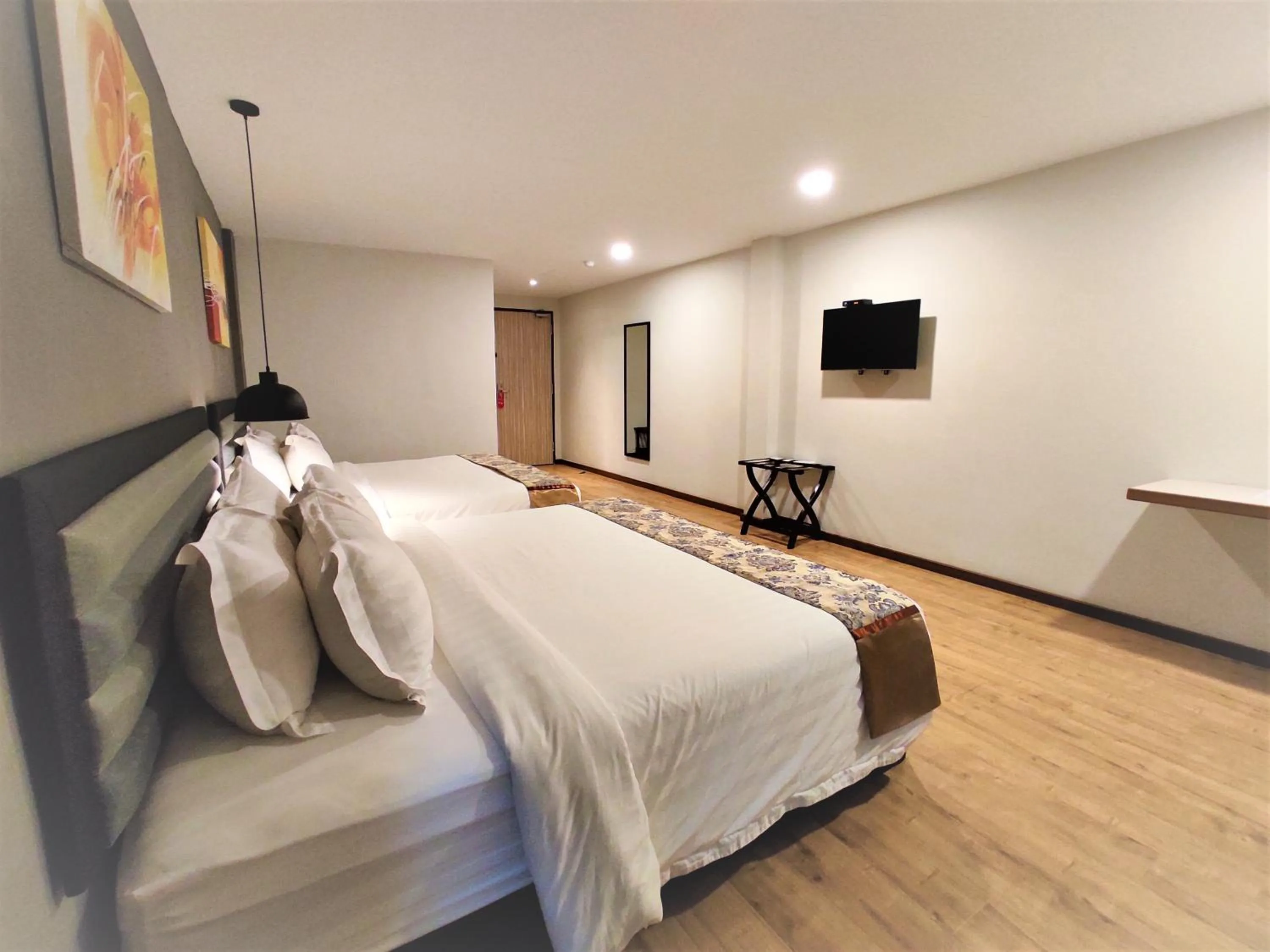 Photo of the whole room, Bed in Apple Suites Hotel