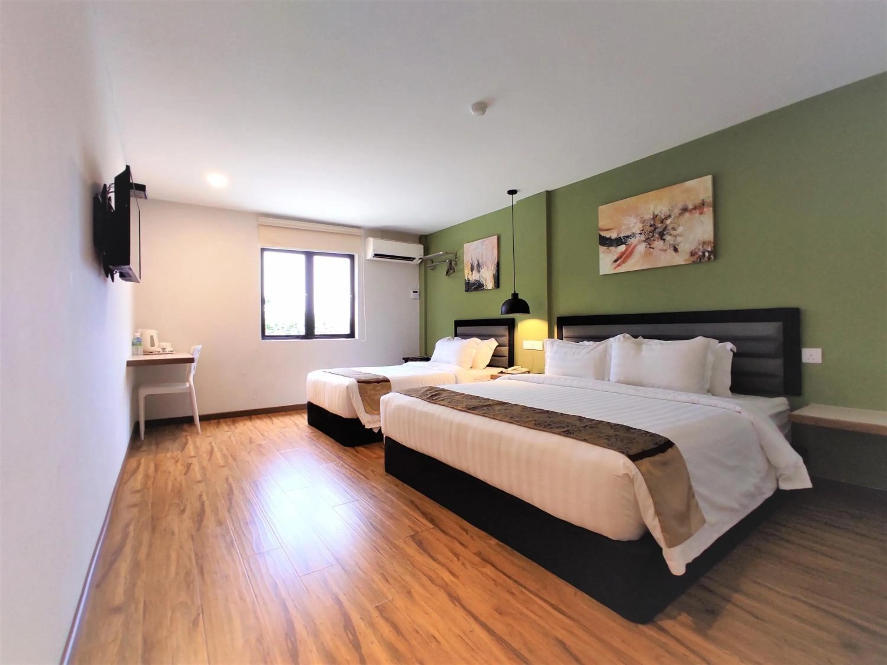 Bed in Apple Suites Hotel