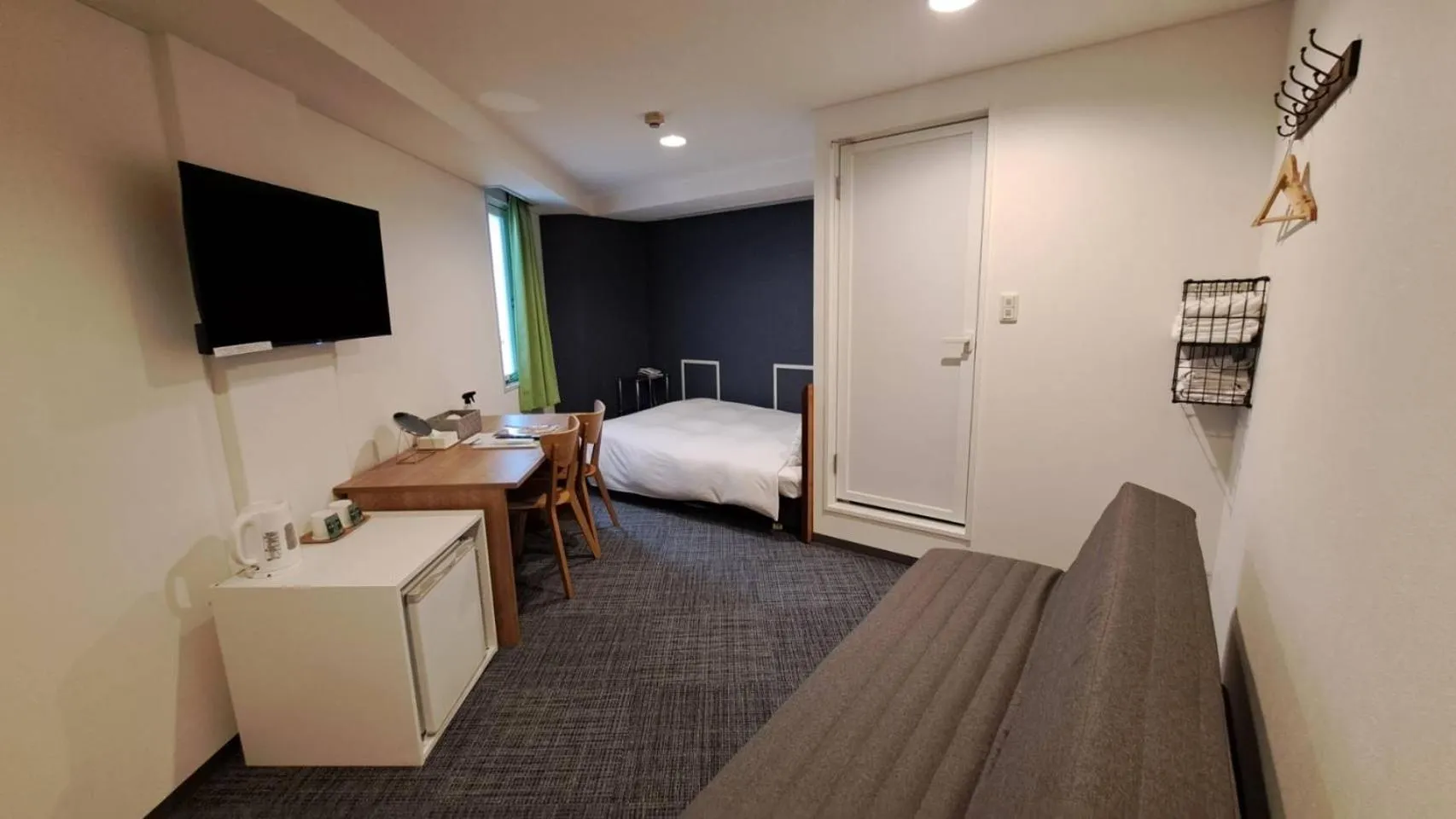 Photo of the whole room, Bed in Grampus Inn Osaka Namba