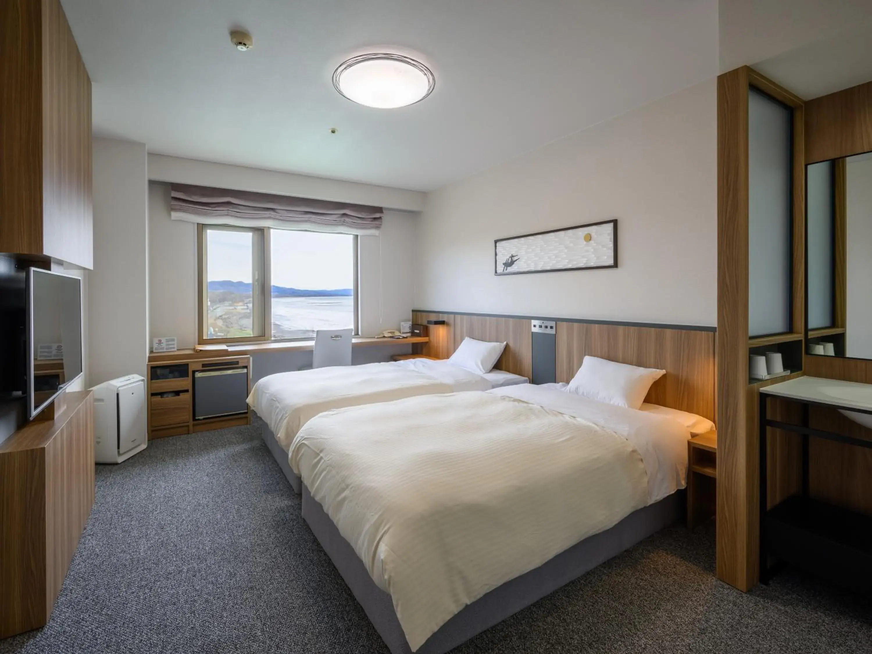 Photo of the whole room, Bed in Lake Saroma Tsuruga Resort Photo of the whole room, Bed in Lake Saroma Tsuruga Resort