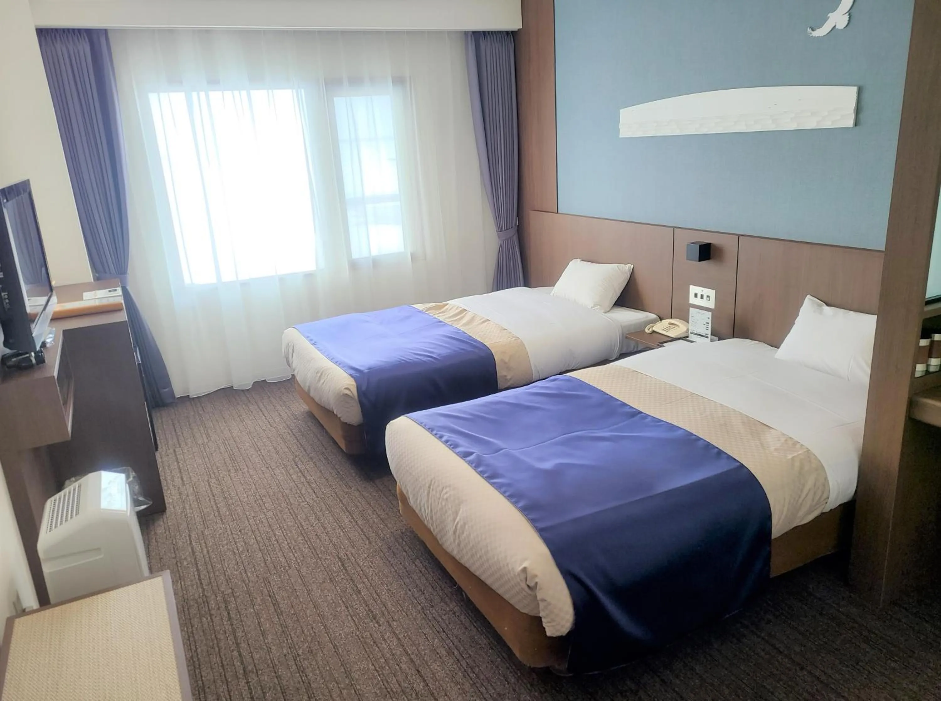 Photo of the whole room, Bed in Lake Saroma Tsuruga Resort