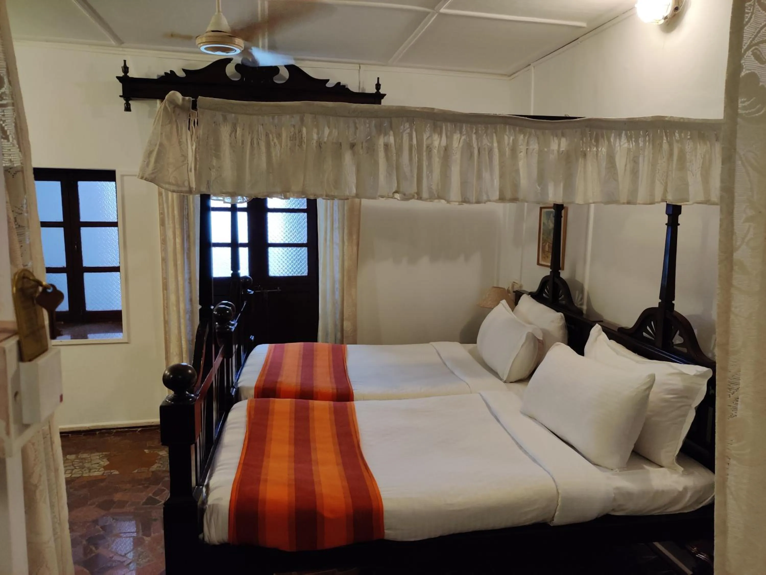 Bed in WelcomHeritage Panjim Inn