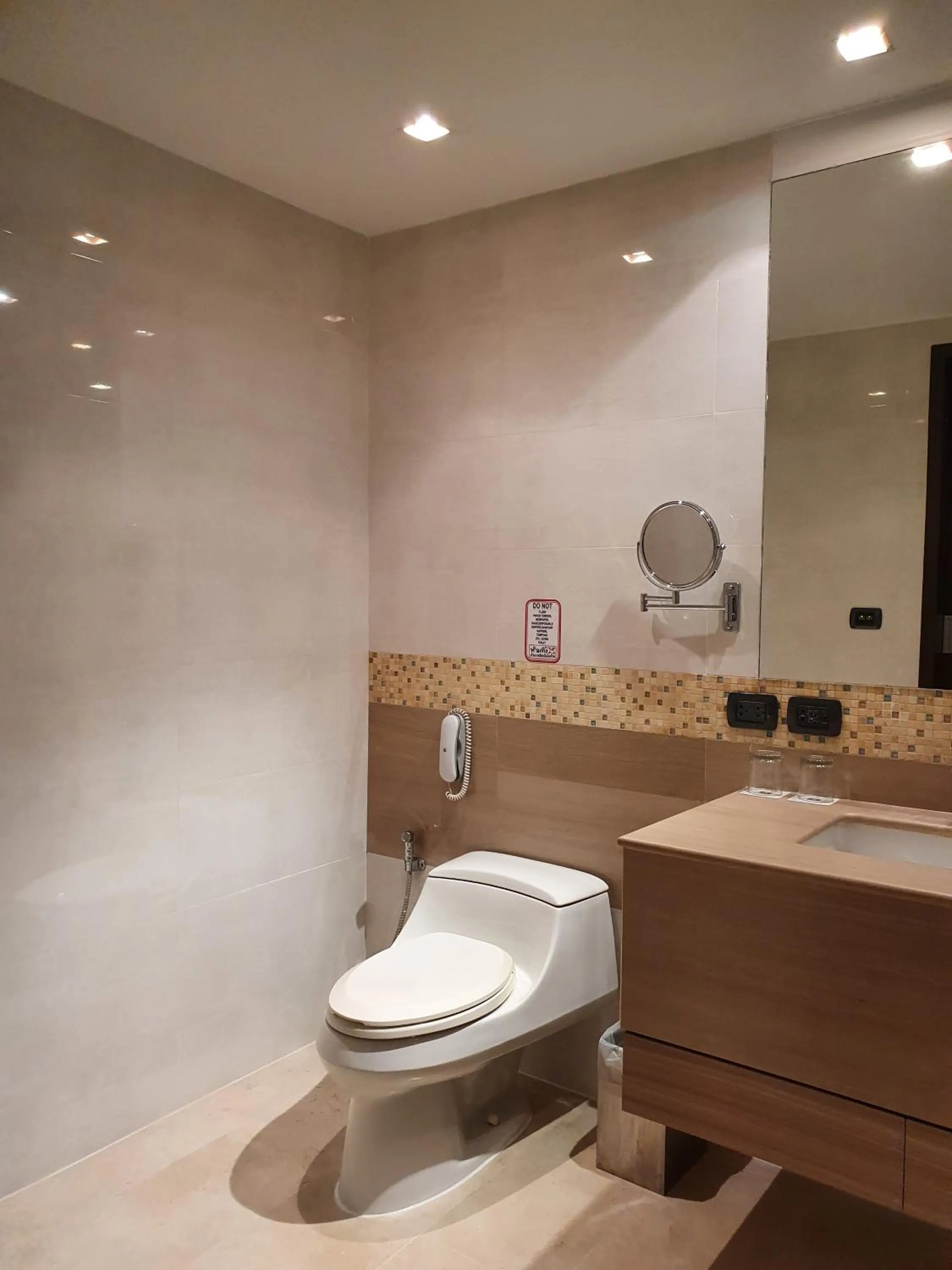 Toilet in Amora NeoLuxe Suites Hotel