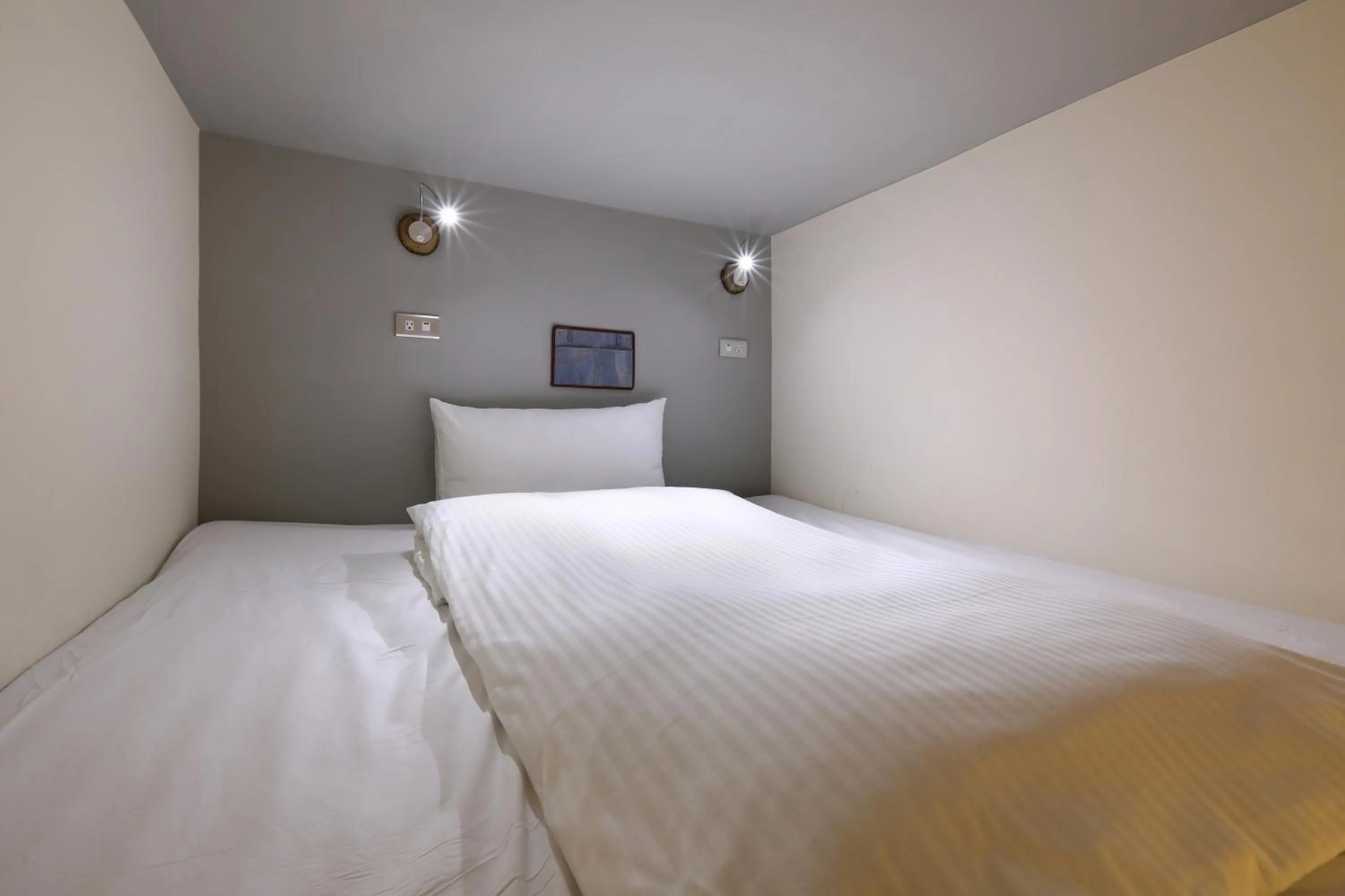 Bed in MINI HOTELS (Taichung Station Branch)