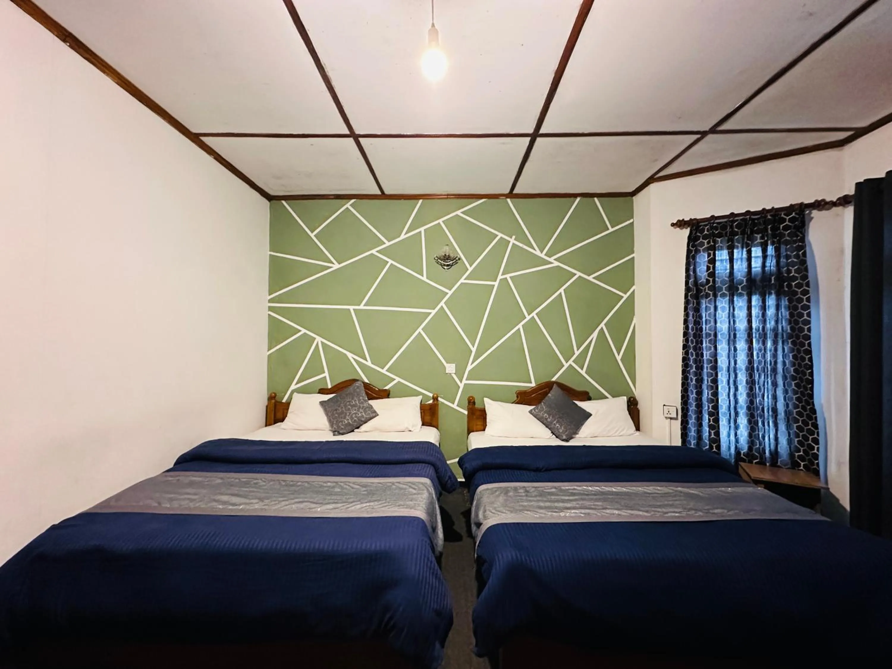 Bed in New Royal Mount Hotel