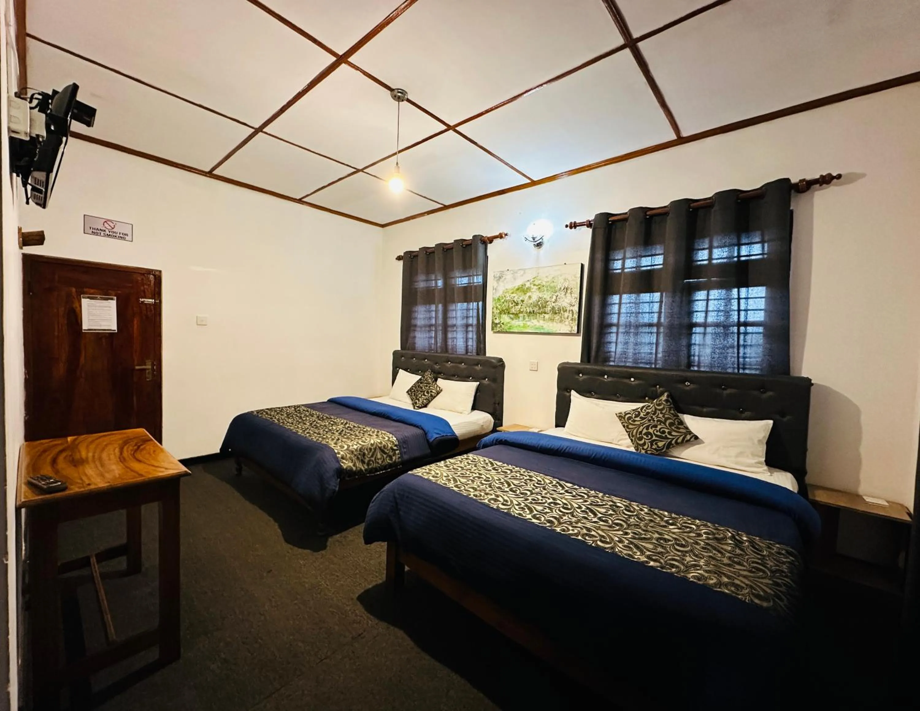 Bed in New Royal Mount Hotel