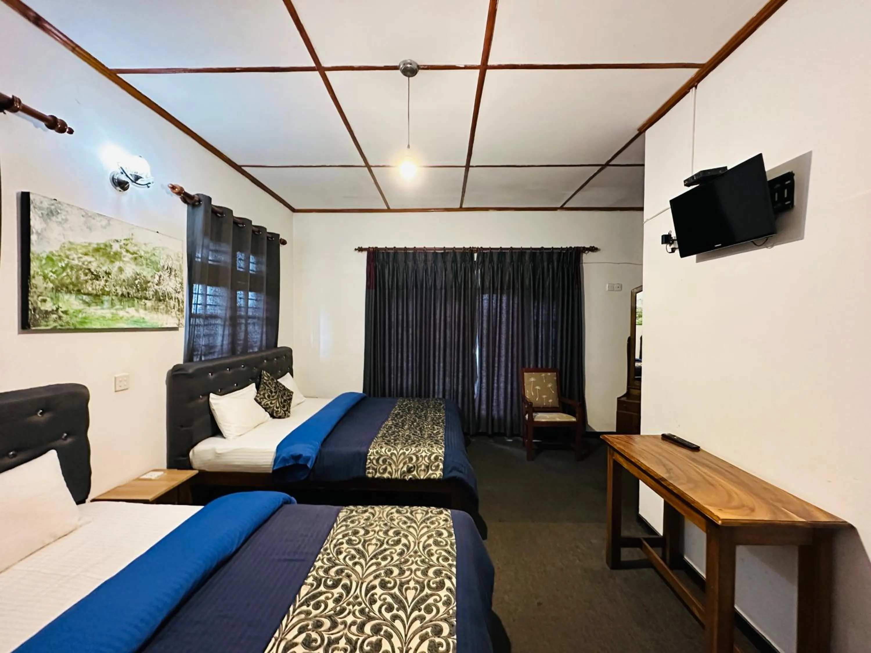 Bed in New Royal Mount Hotel