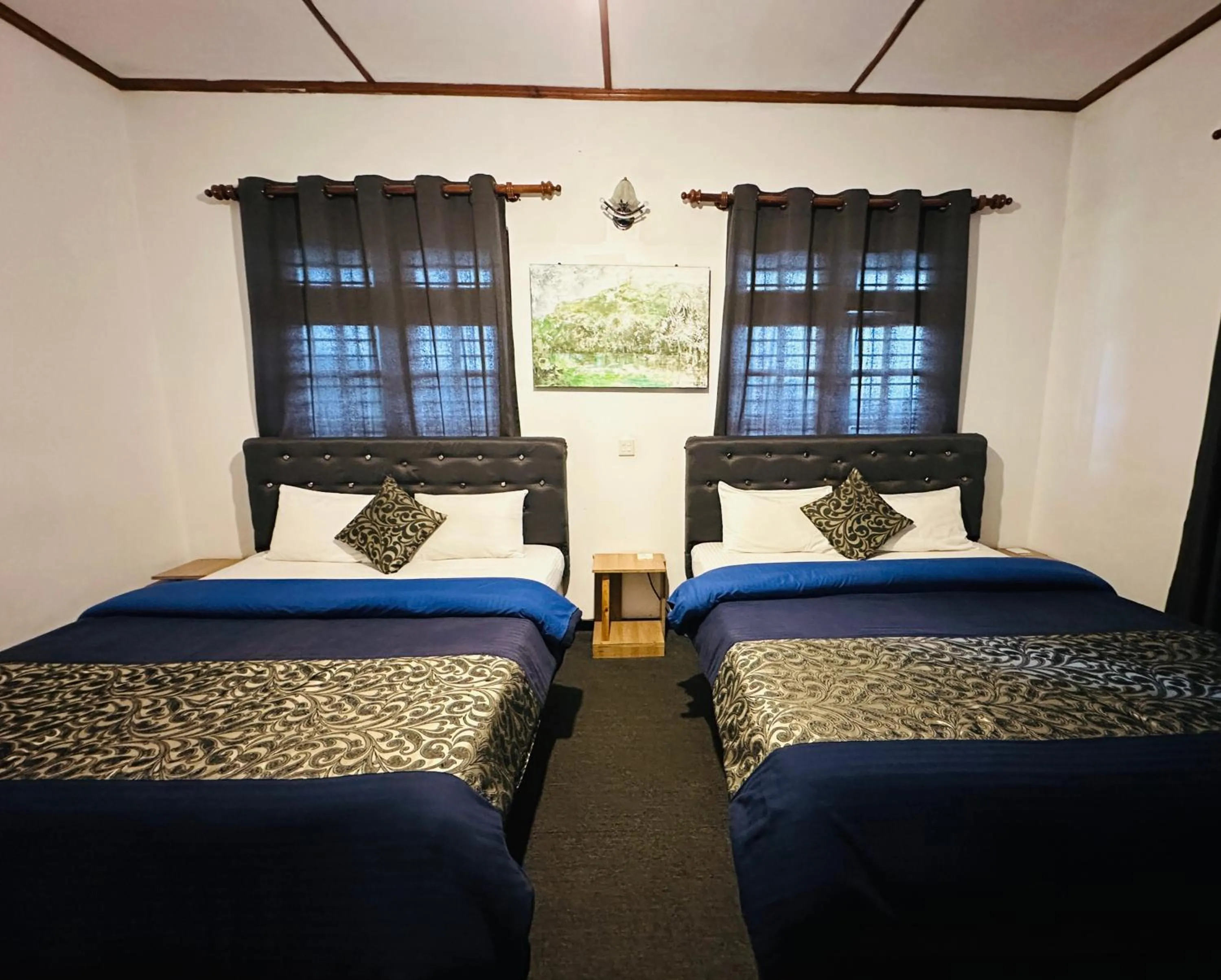 Bed in New Royal Mount Hotel