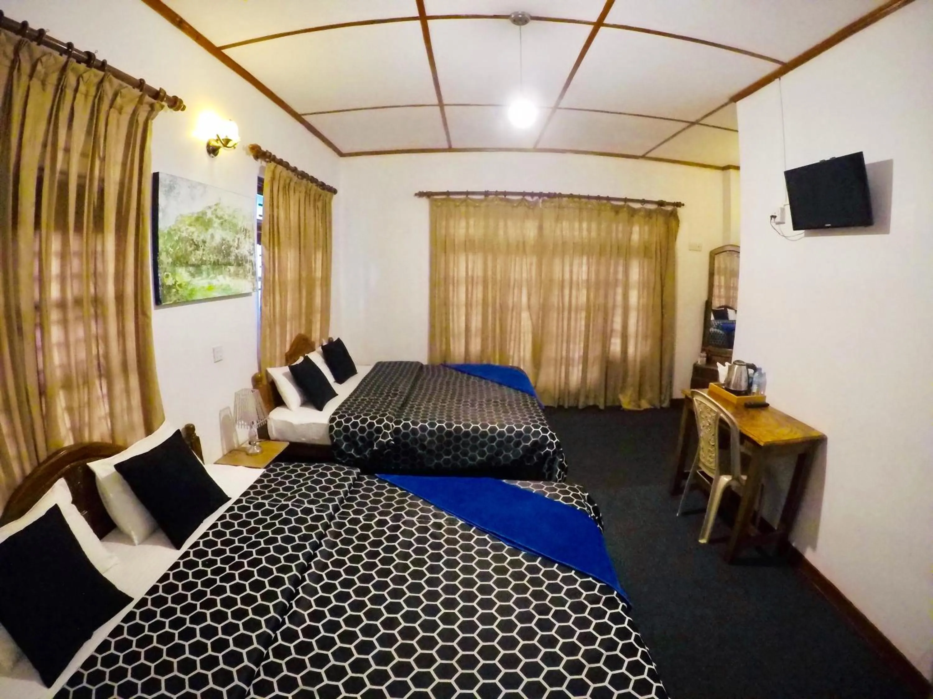 Bed in New Royal Mount Hotel