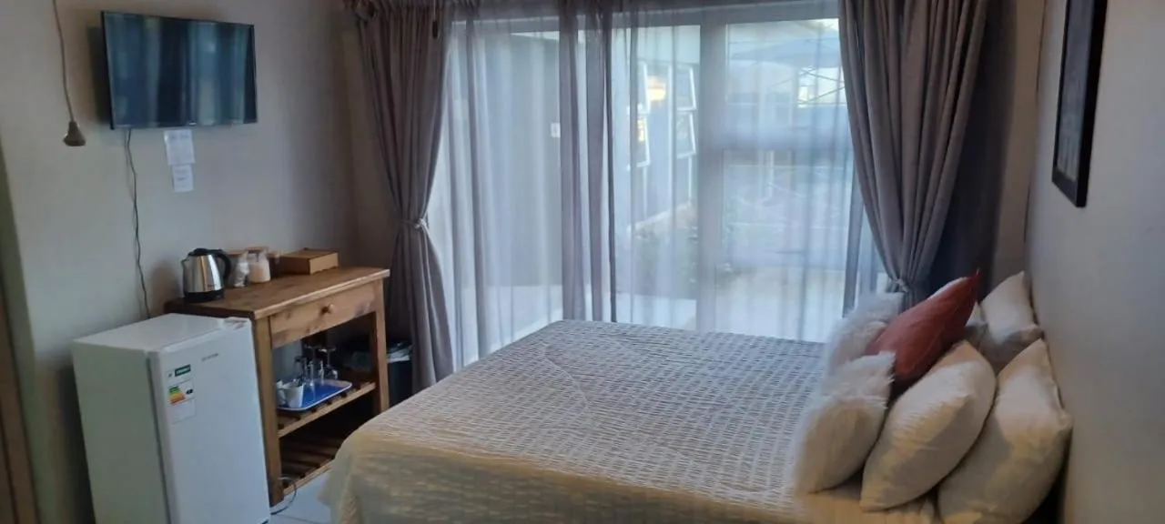 Bed in Oppi Draai Guesthouse