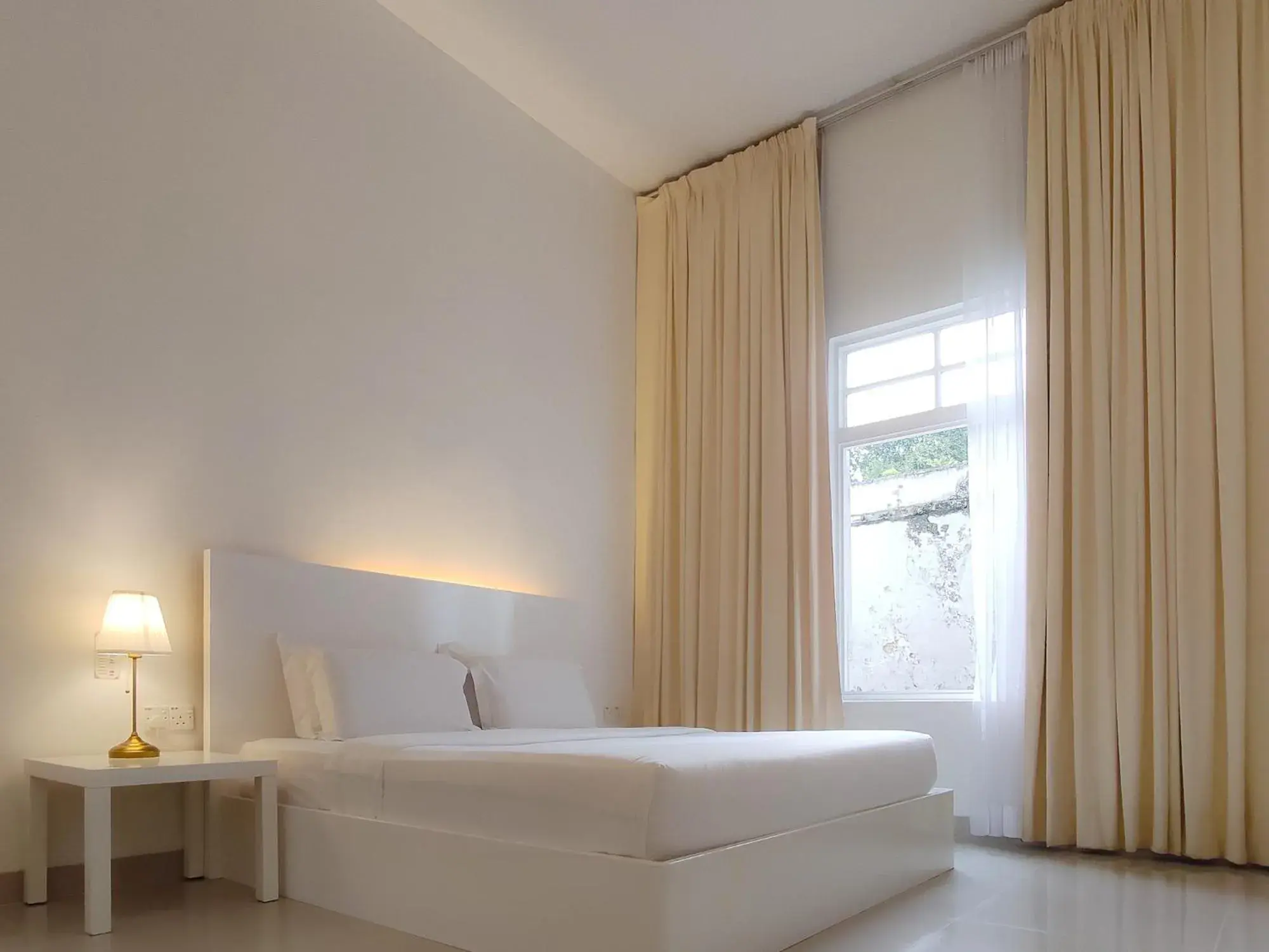 Bed in Chulia Heritage Hotel Bed in Chulia Heritage Hotel